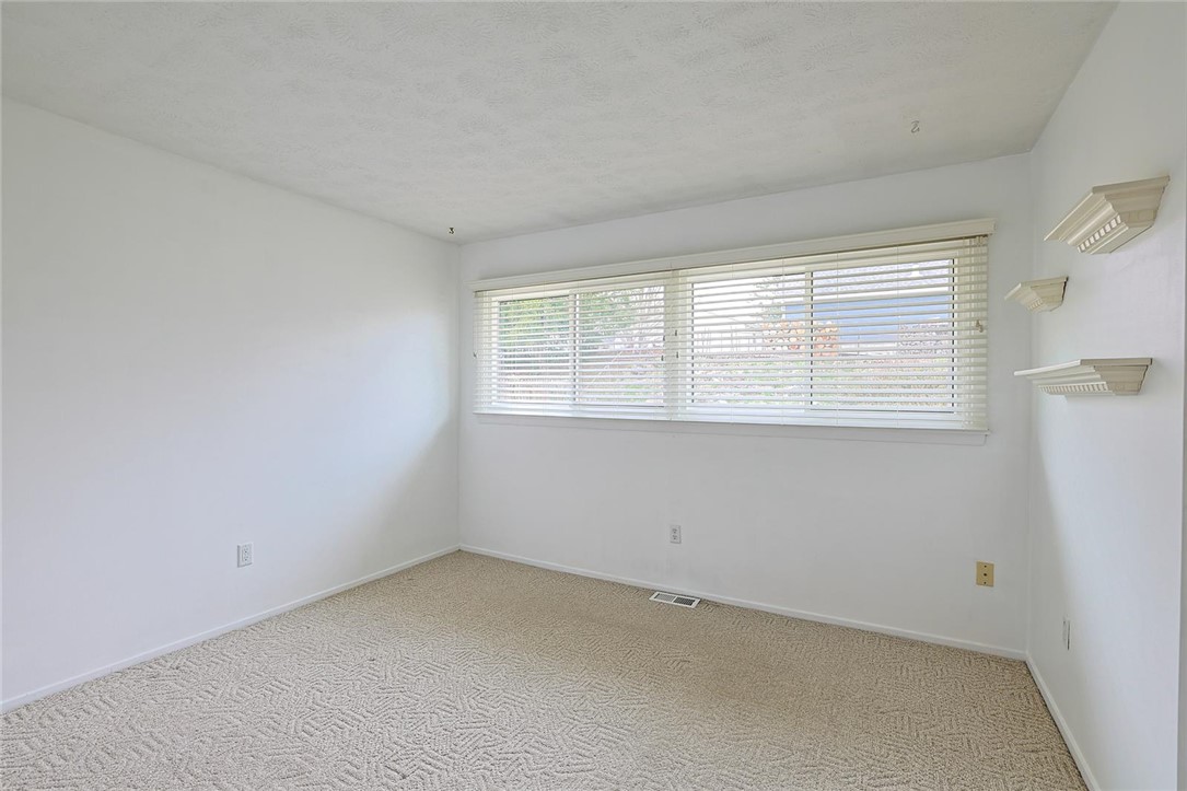 4307 Meadowcroft Road Dayton, OH 45429 - Photo 13 of 26 This spacious room offers comfort and versatility for various uses.