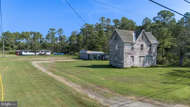 a view of a house with a big yard
