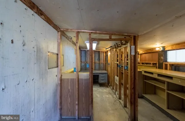 a bathroom with a shower and a sink