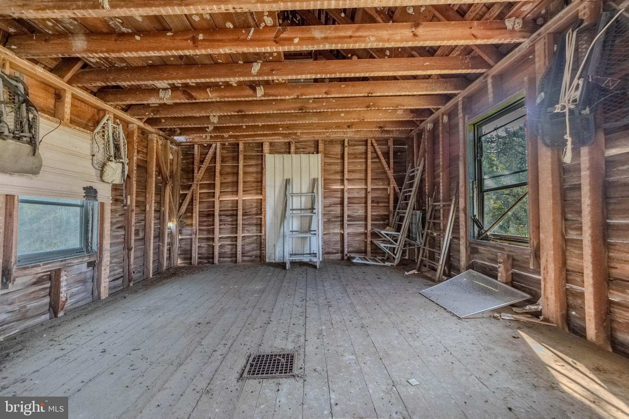 27020 Oriole Road Princess Anne, MD 21853 - Photo 22 of 24 a view of an empty room with wooden floor and a sink