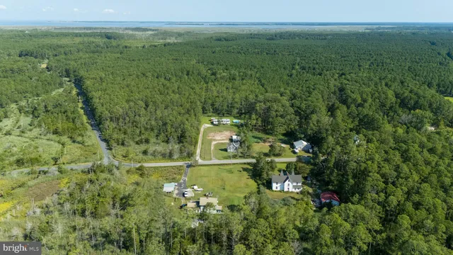 a aerial view of a house with a yard