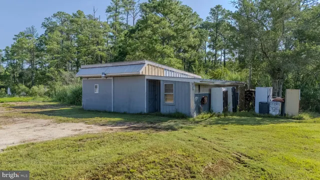 a view of a backyard of the house