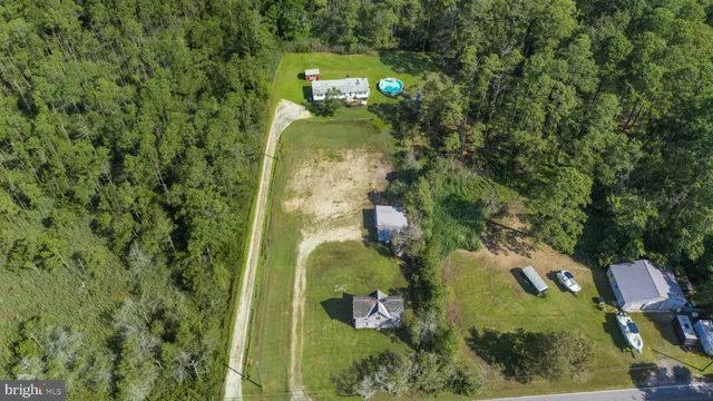 an aerial view of a residential houses with outdoor space