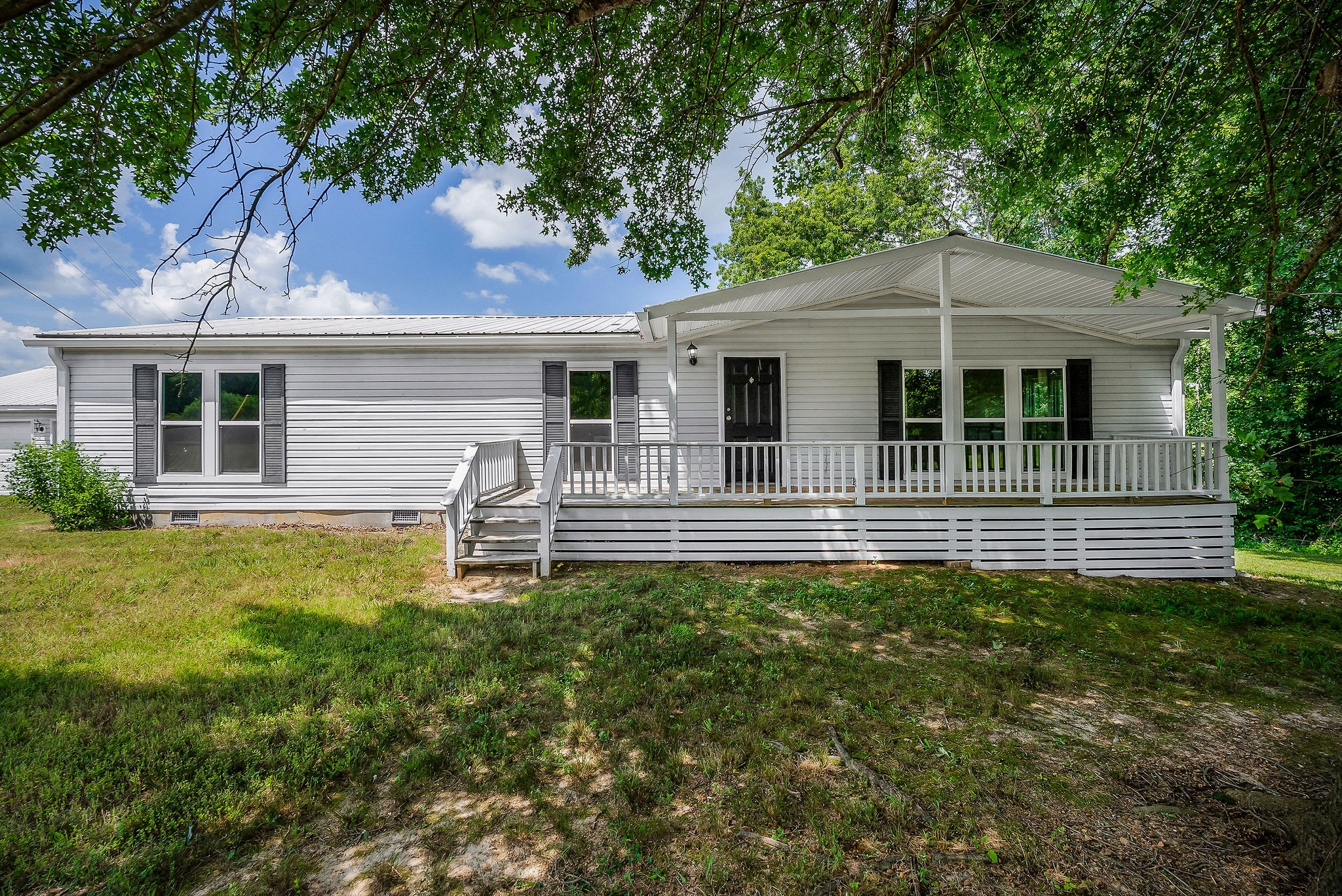 a backyard of a house with seating space