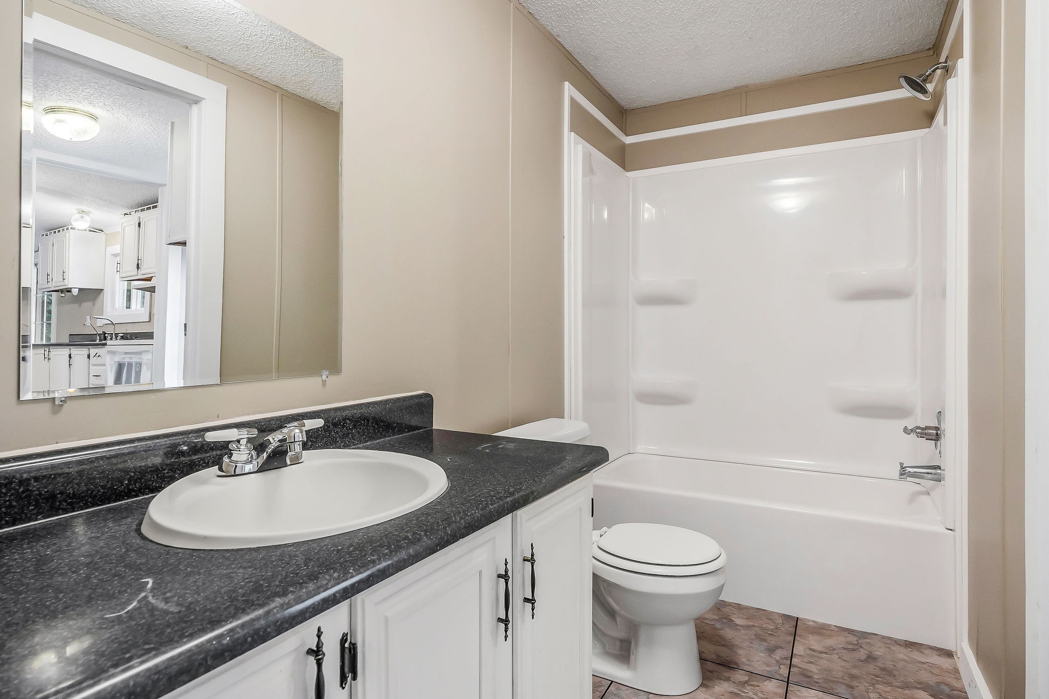 572 Lakeside Road Byrdstown, TN 38549 - Photo 23 of 44 a bathroom with a granite countertop sink toilet and shower