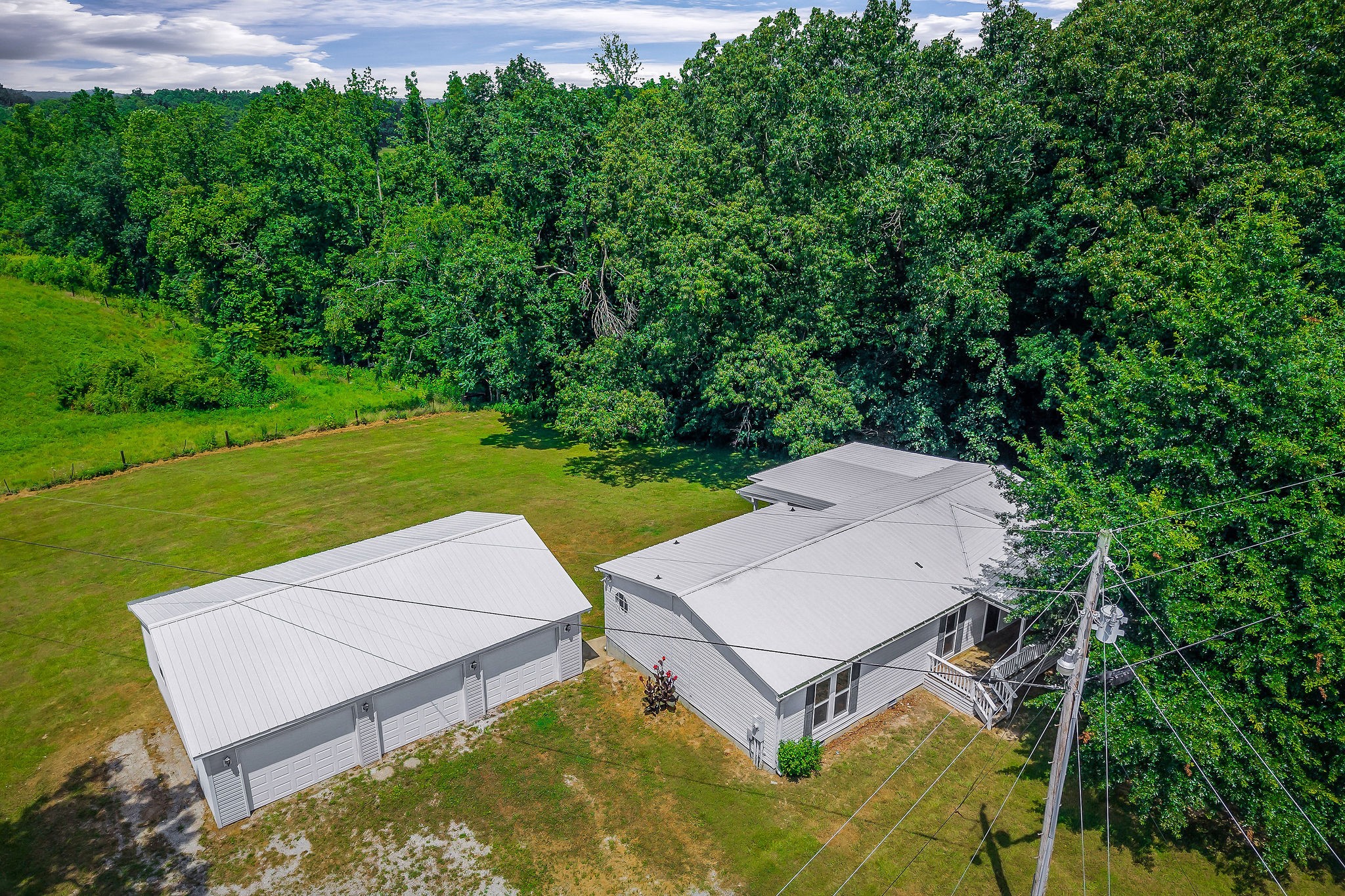 572 Lakeside Road Byrdstown, TN 38549 - Photo 3 of 44 an aerial view of a house with garden space and street view