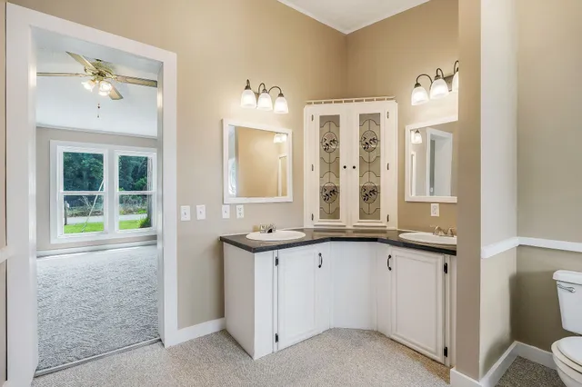 a view of a house with a yard and a garden