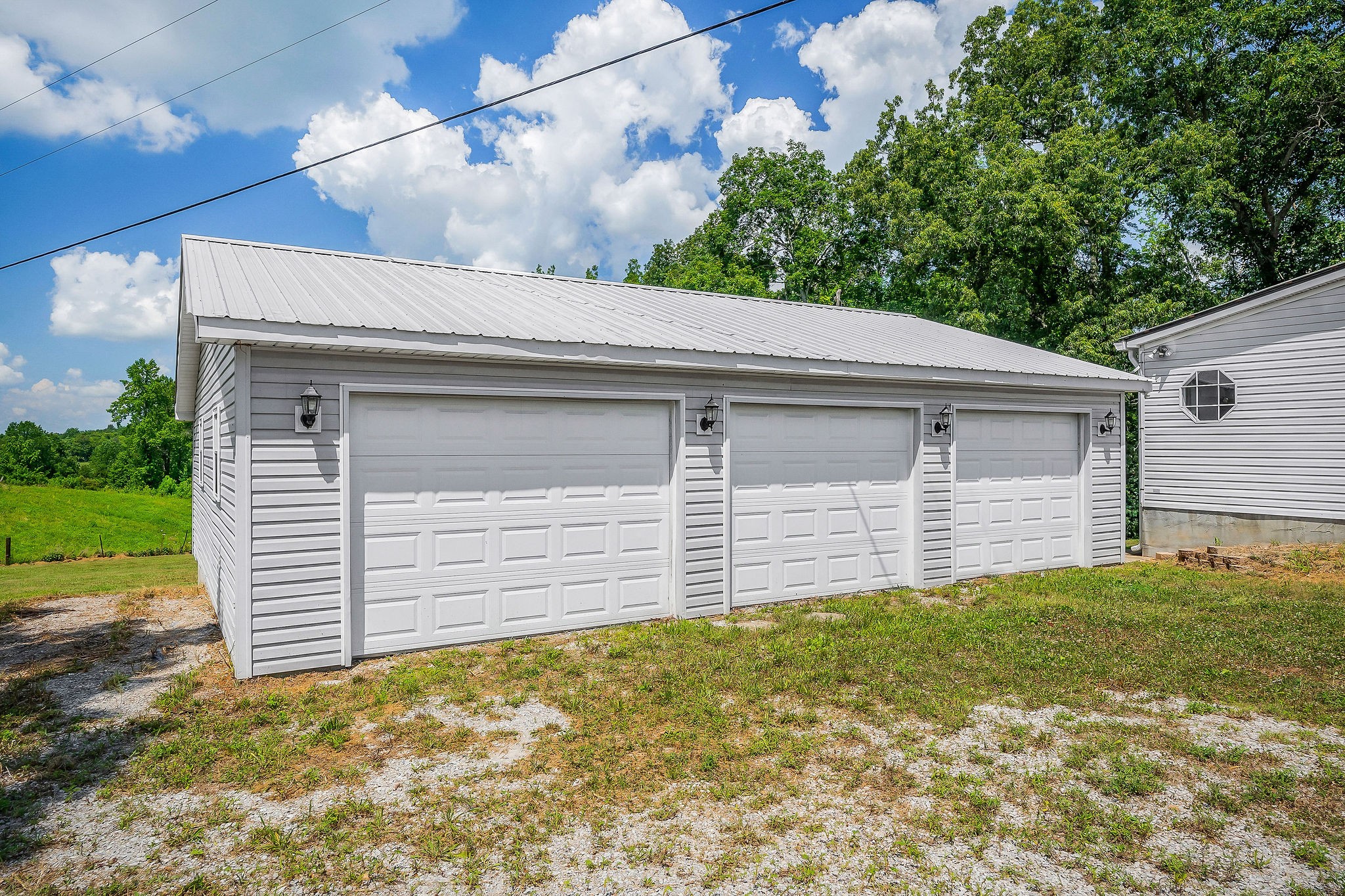 572 Lakeside Road Byrdstown, TN 38549 - Photo 36 of 44 a front view of a house with a garage