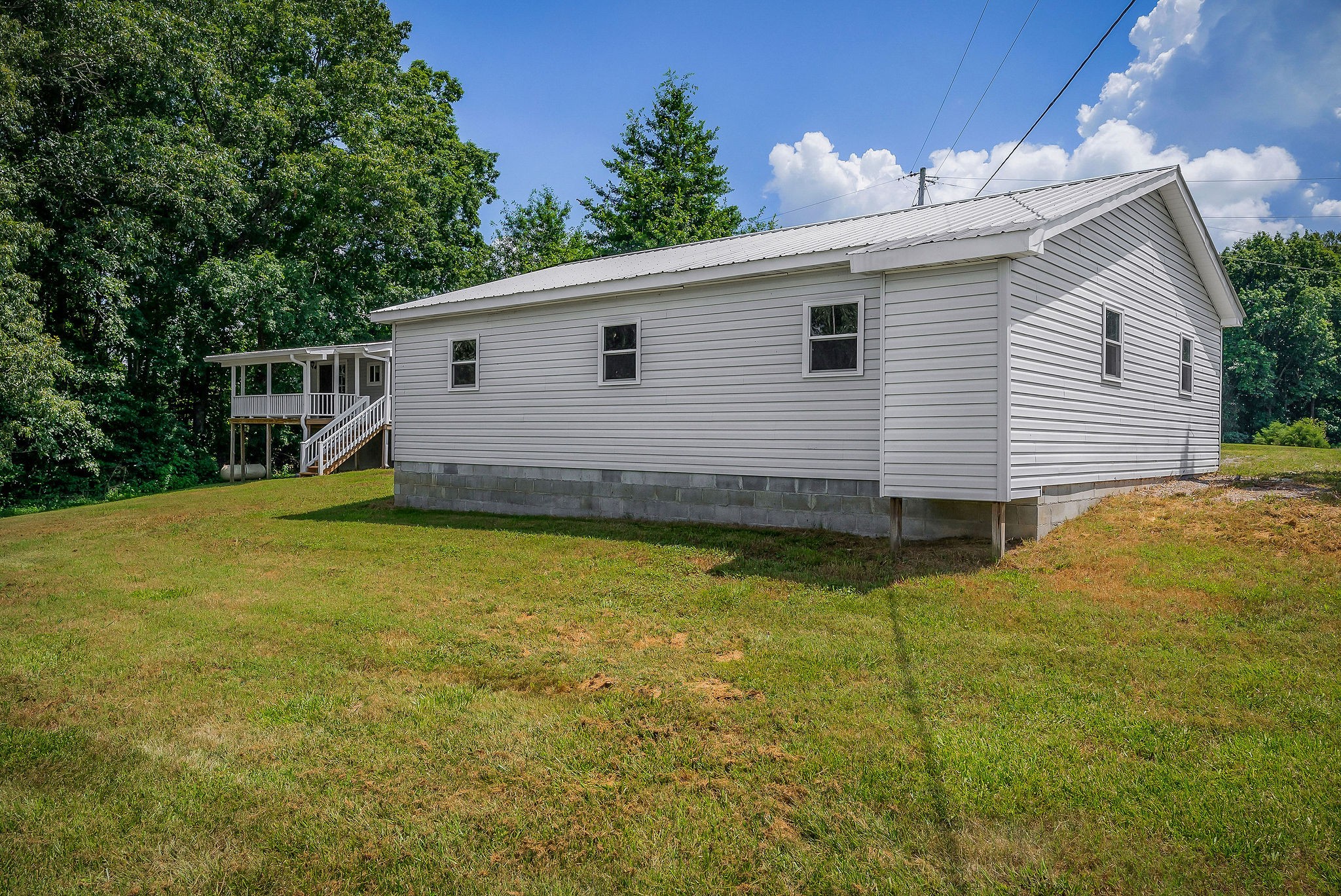 572 Lakeside Road Byrdstown, TN 38549 - Photo 38 of 44 a view of a house with a backyard
