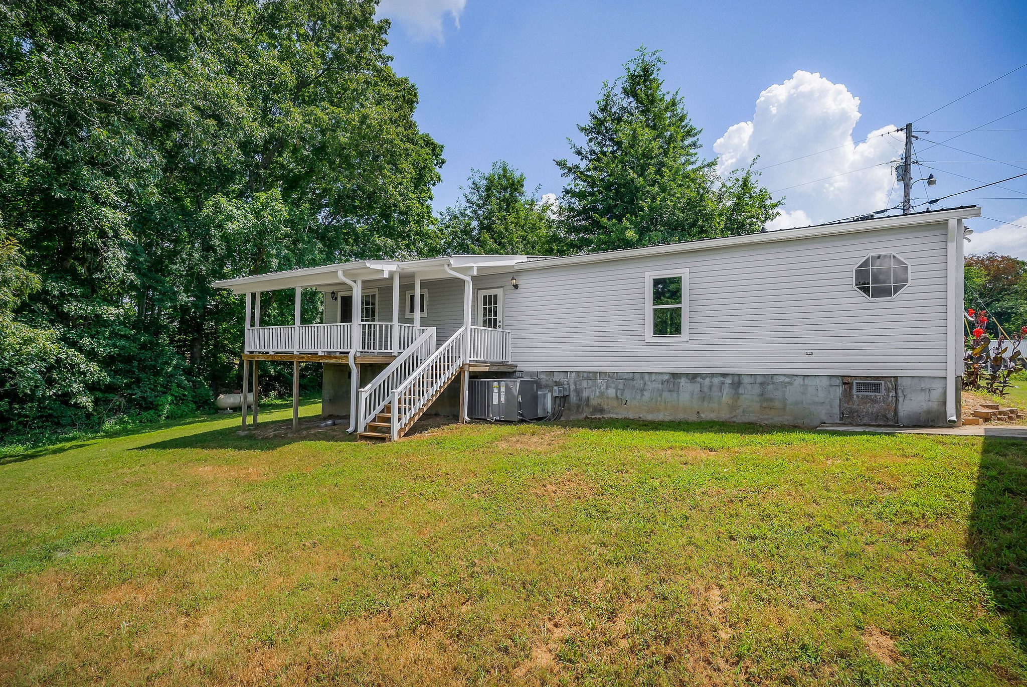 572 Lakeside Road Byrdstown, TN 38549 - Photo 39 of 44 a view of a house with pool and sitting area