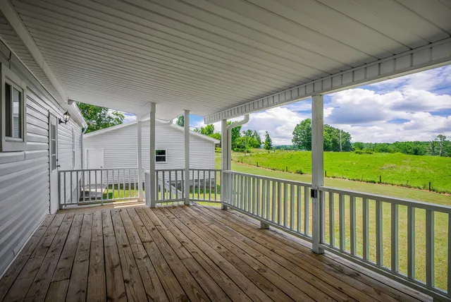a view of a lake with houses in the background
