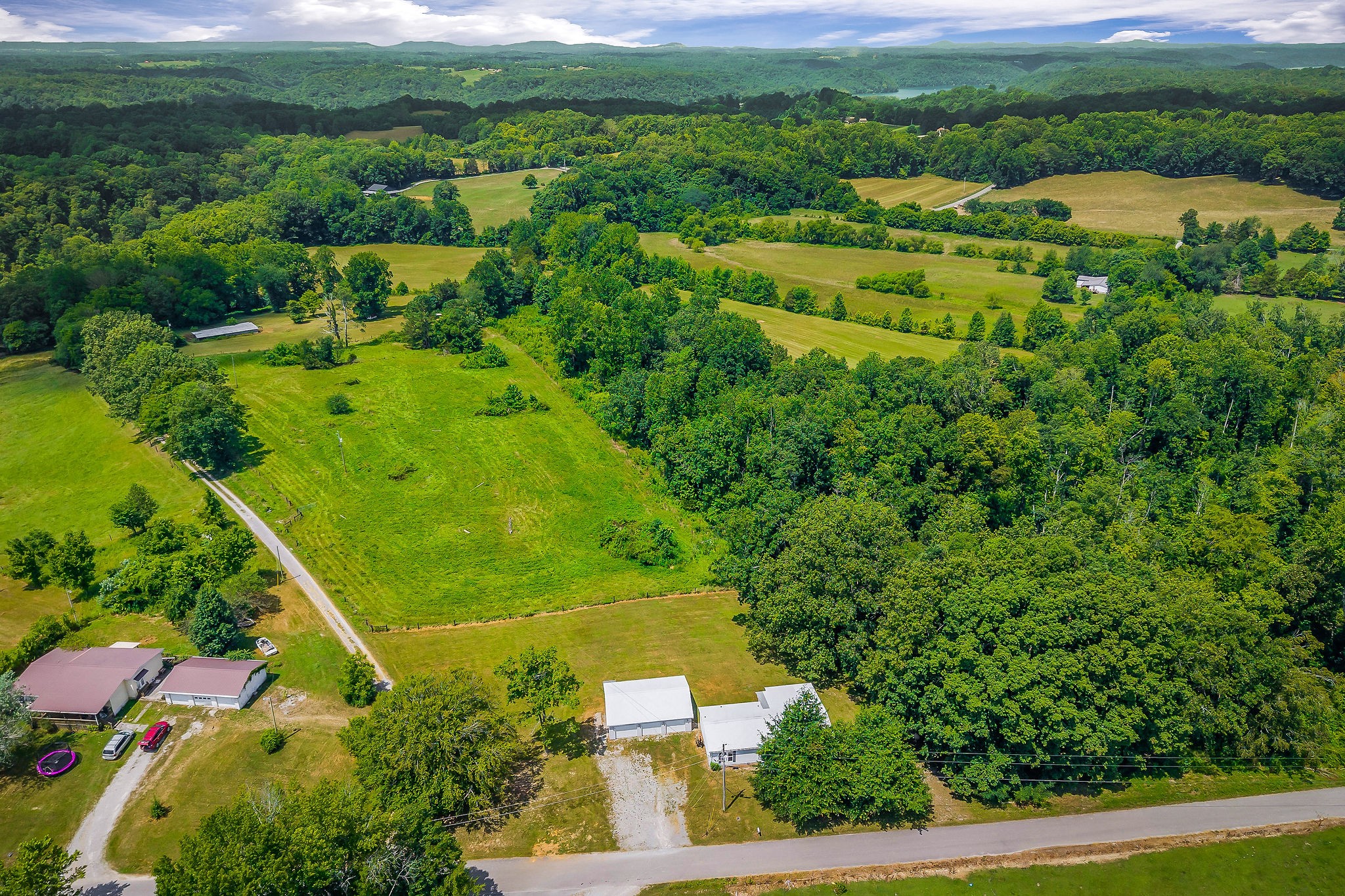 572 Lakeside Road Byrdstown, TN 38549 - Photo 8 of 44 an aerial view of residential houses with outdoor space and trees