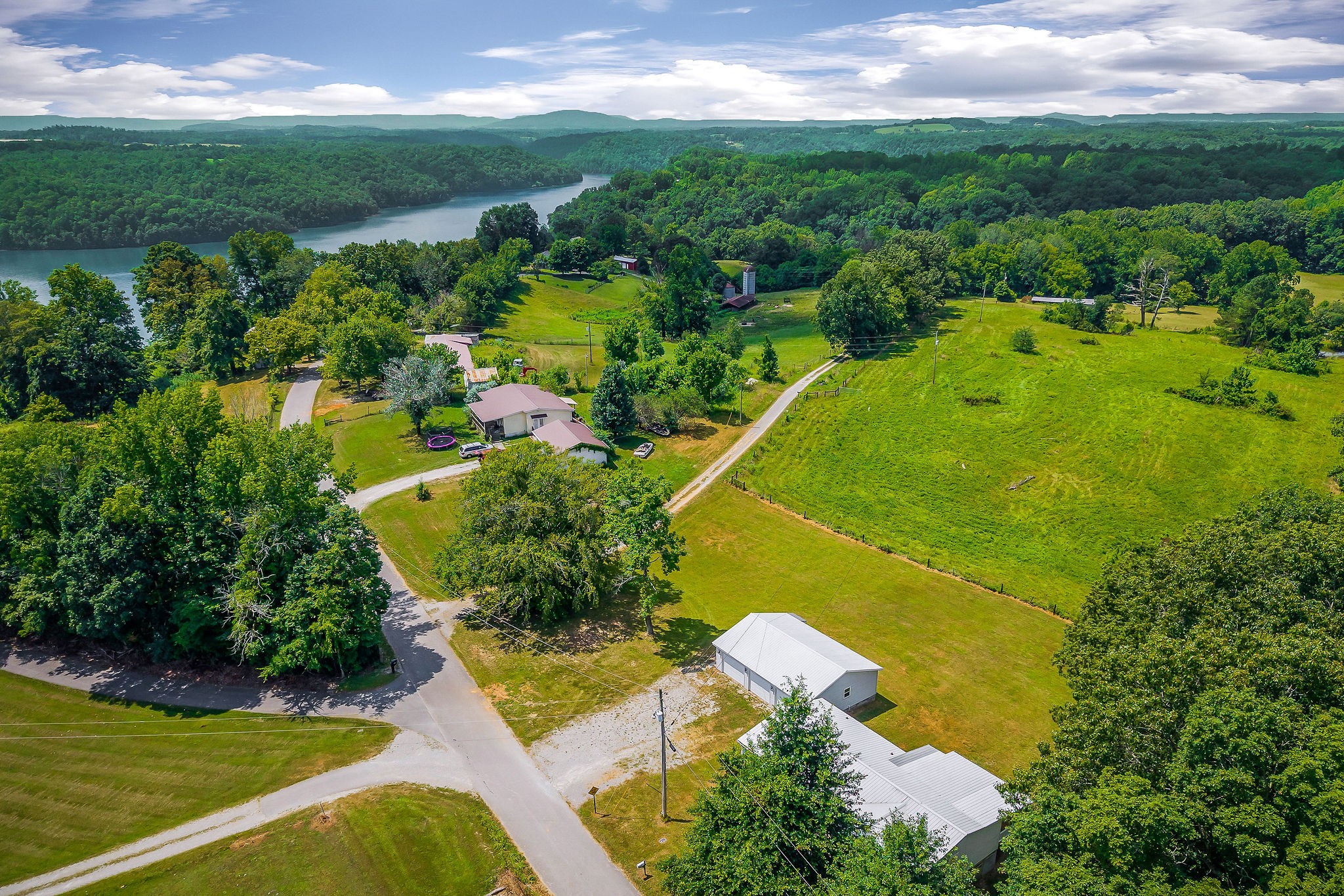 572 Lakeside Road Byrdstown, TN 38549 - Photo 9 of 44 an aerial view of a residential houses with outdoor space and trees all around