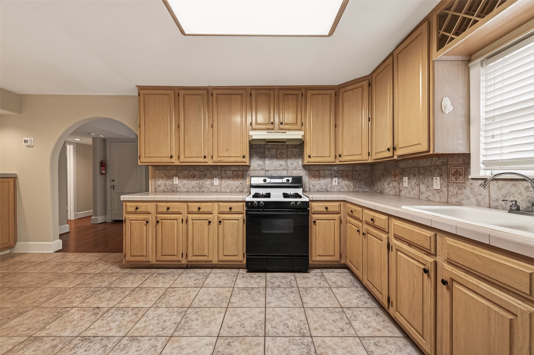 1807 Crocker Street, Unit A Houston, TX 77006 - Photo 11 of 37 Kitchen features a gas range and big double sink.
