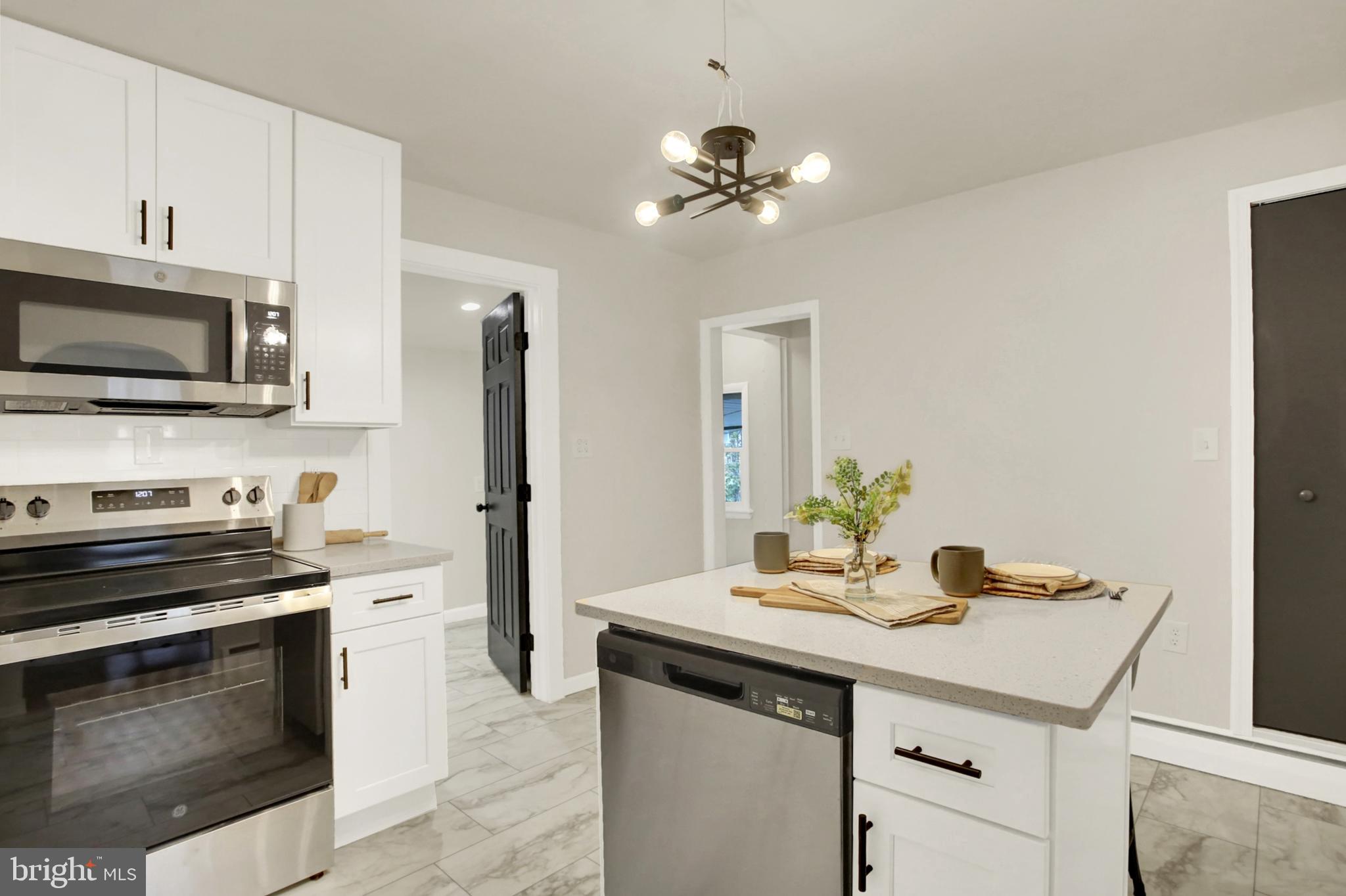 507 Magaro Road Enola, PA 17025 - Photo 11 of 35 a kitchen with a sink stove and microwave