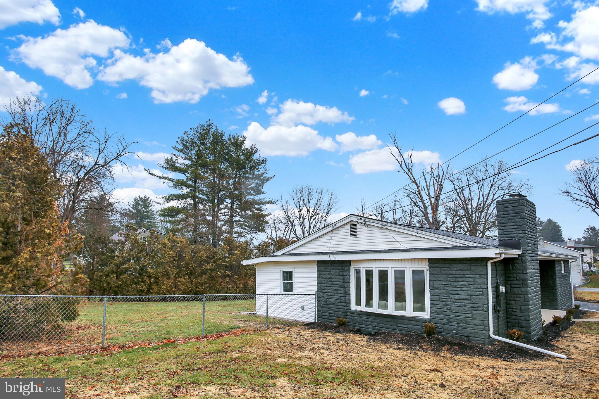 507 Magaro Road Enola, PA 17025 - Photo 33 of 35 a front view of a house with a garden and lake view