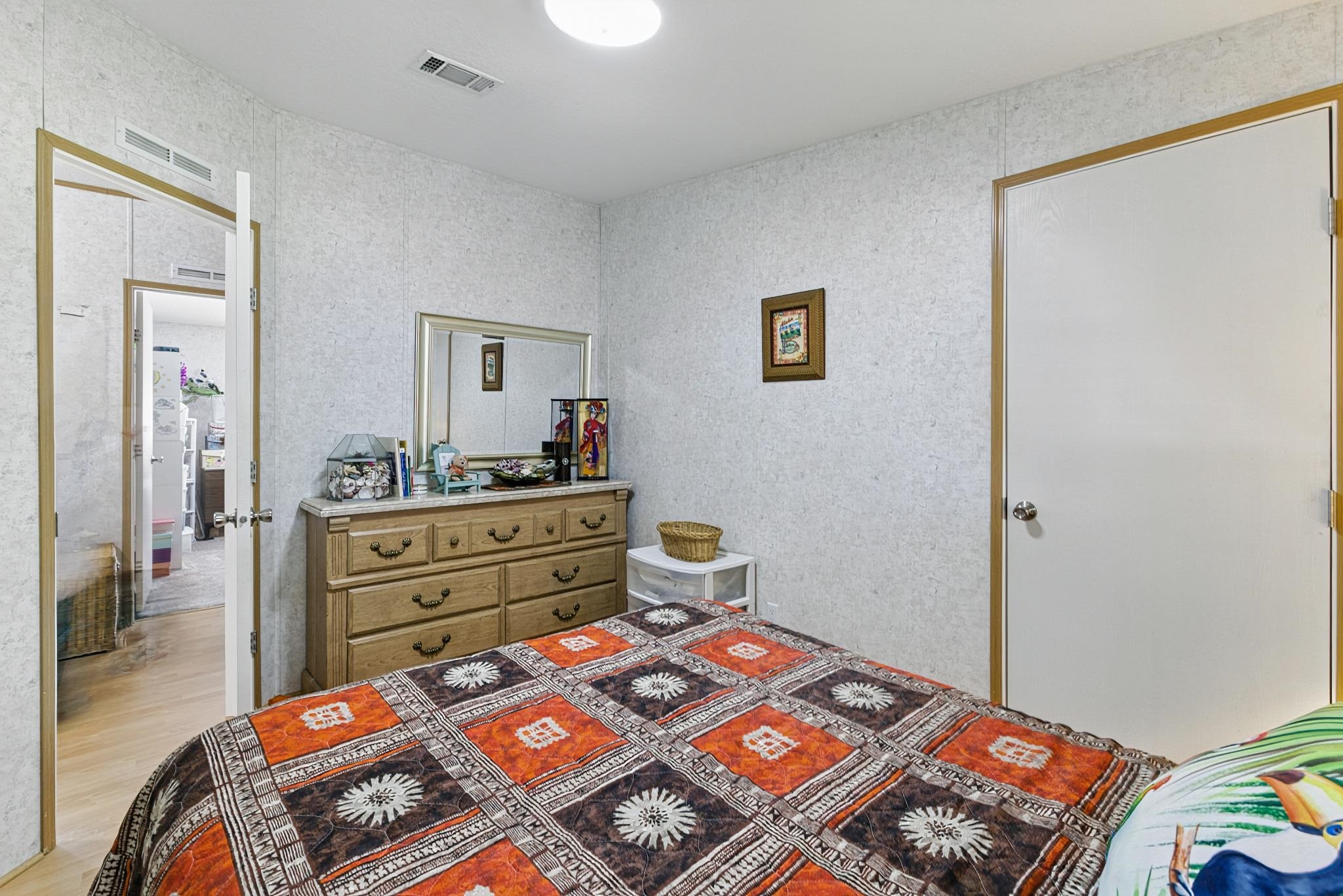 2257 Whippoorwill Drive St. Augustine, FL 32084 - Photo 28 of 50 a bed room with a bed and a dresser