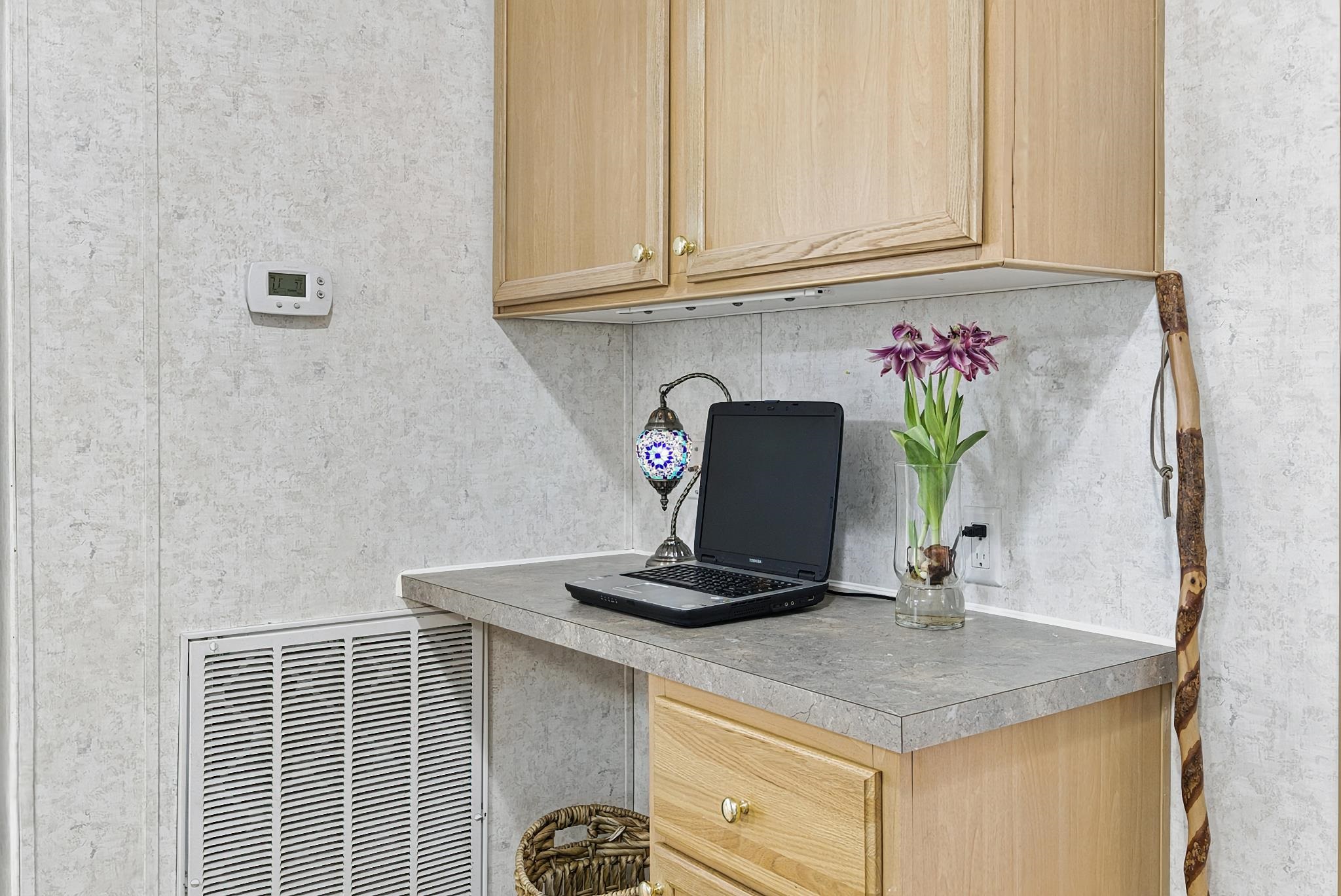2257 Whippoorwill Drive St. Augustine, FL 32084 - Photo 31 of 50 a bathroom with a granite countertop sink and a white cabinet