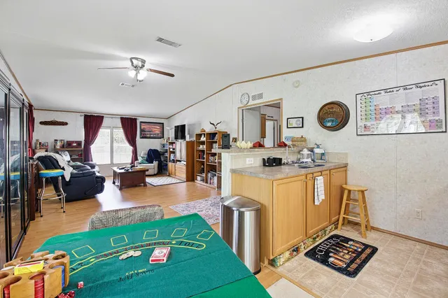 a kitchen with a refrigerator a stove a washer and dryer
