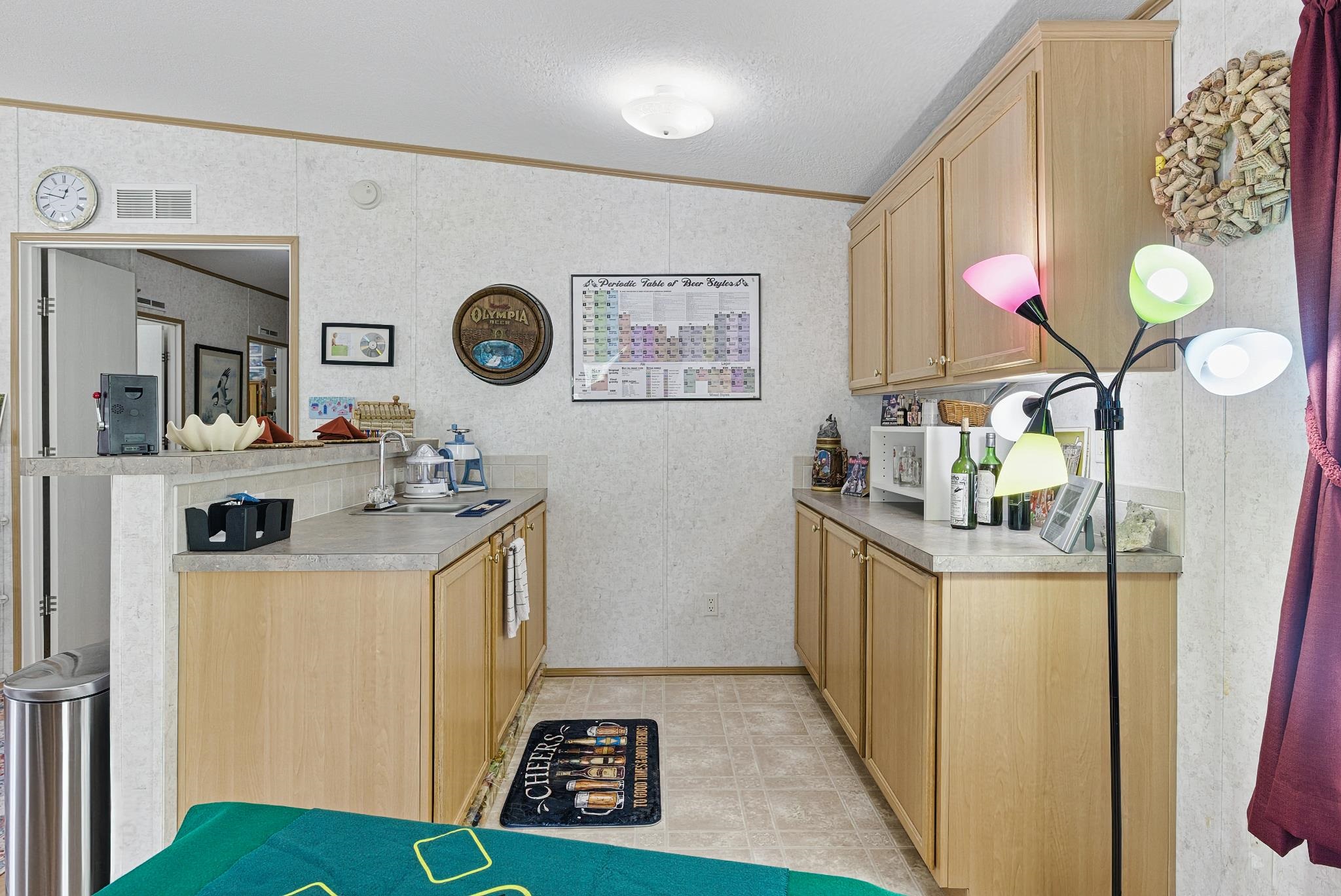 2257 Whippoorwill Drive St. Augustine, FL 32084 - Photo 33 of 50 a kitchen with a refrigerator a stove a washer and dryer