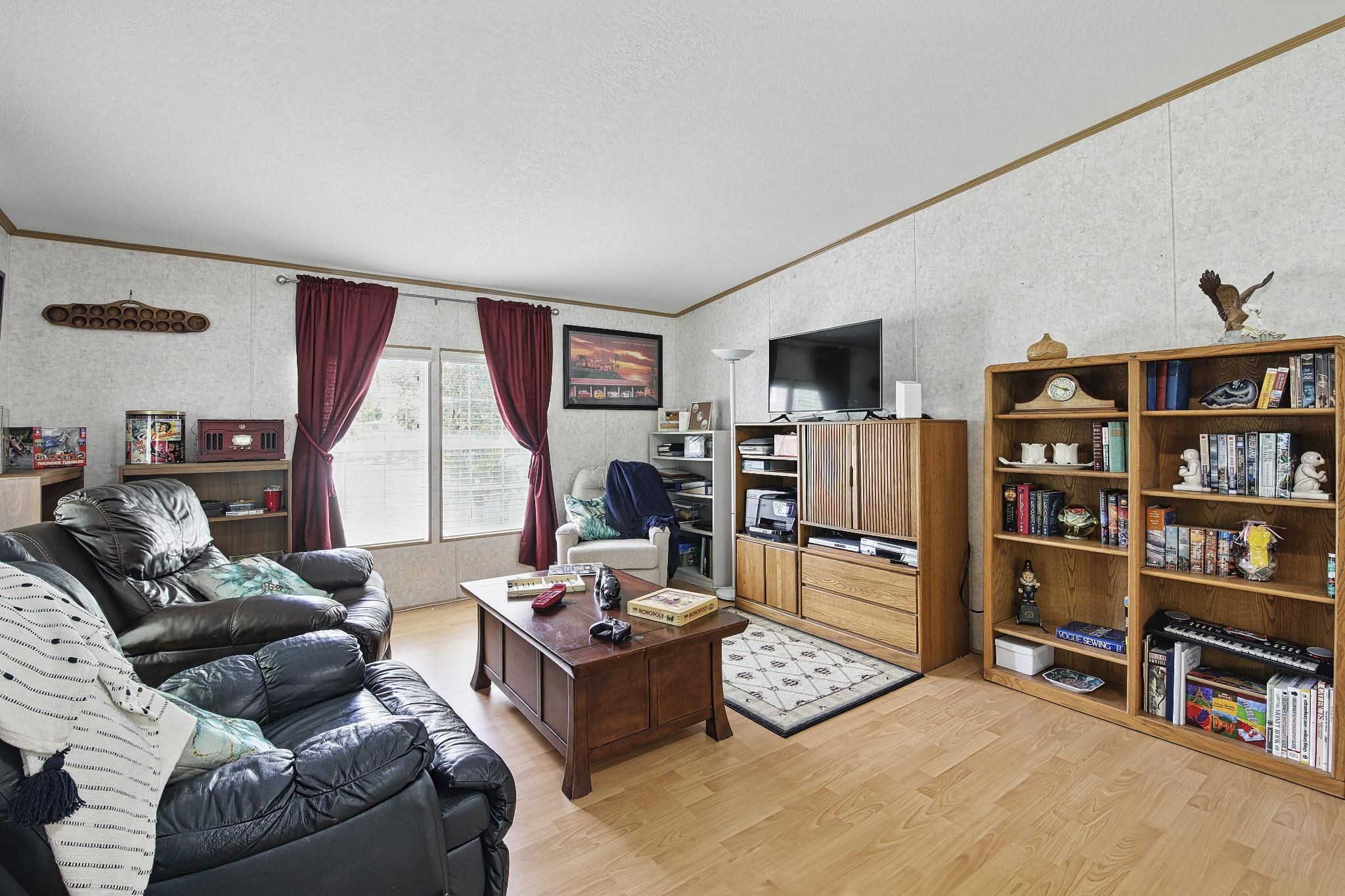 2257 Whippoorwill Drive St. Augustine, FL 32084 - Photo 35 of 50 a living room with furniture and a flat screen tv