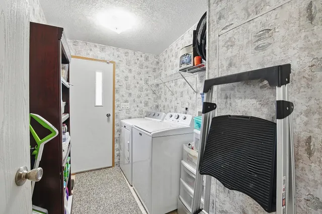 a living room filled with furniture and garden view