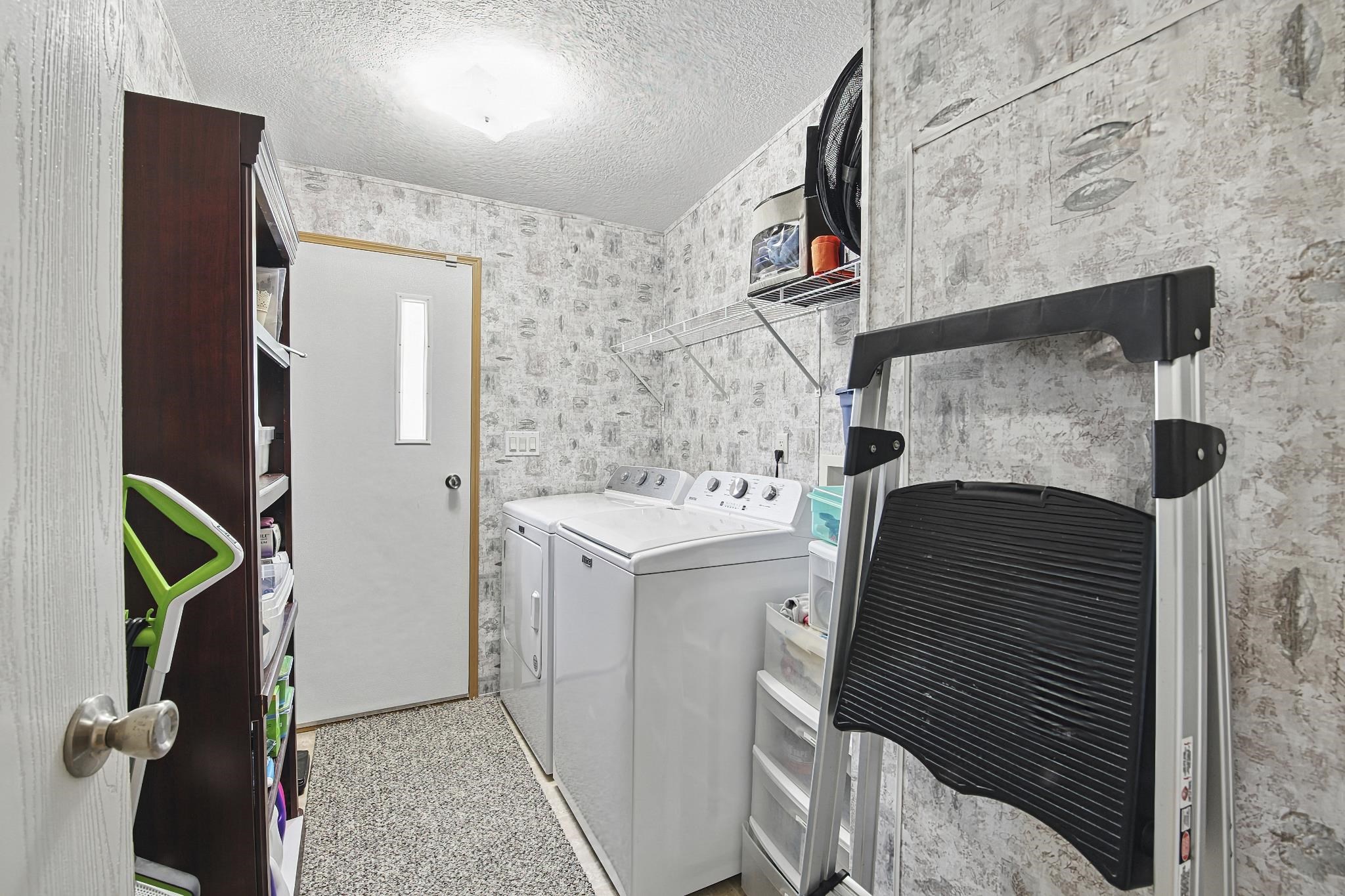2257 Whippoorwill Drive St. Augustine, FL 32084 - Photo 38 of 50 a utility room with dryer and washer