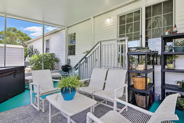 a view of an outdoor sitting area with furniture