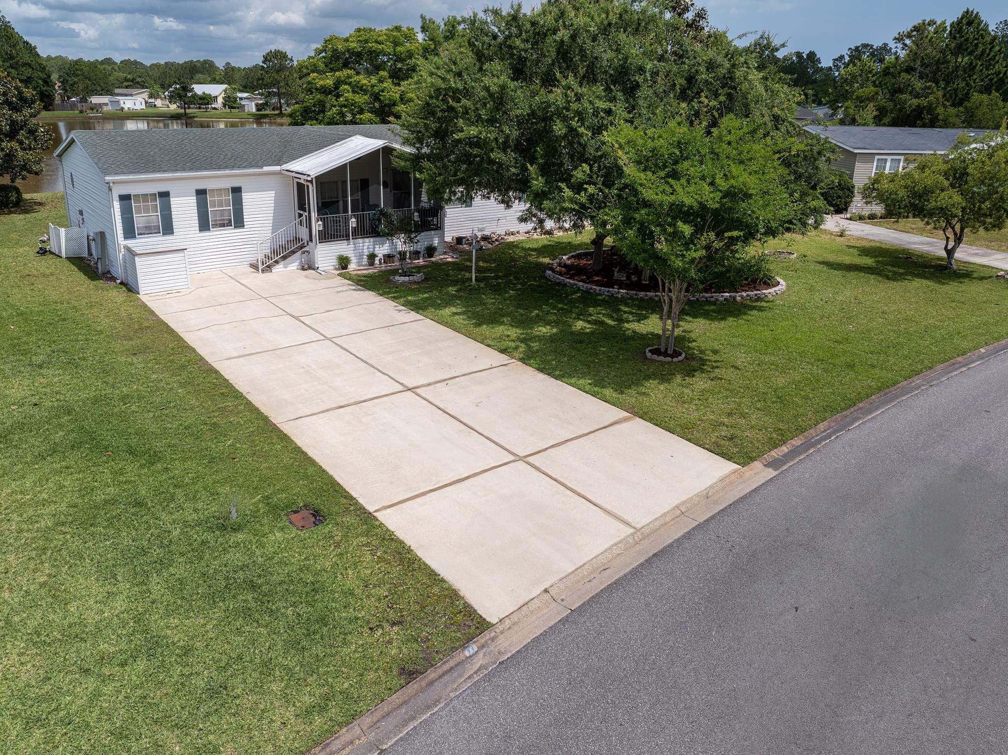 2257 Whippoorwill Drive St. Augustine, FL 32084 - Photo 45 of 50 a front view of a house with garden
