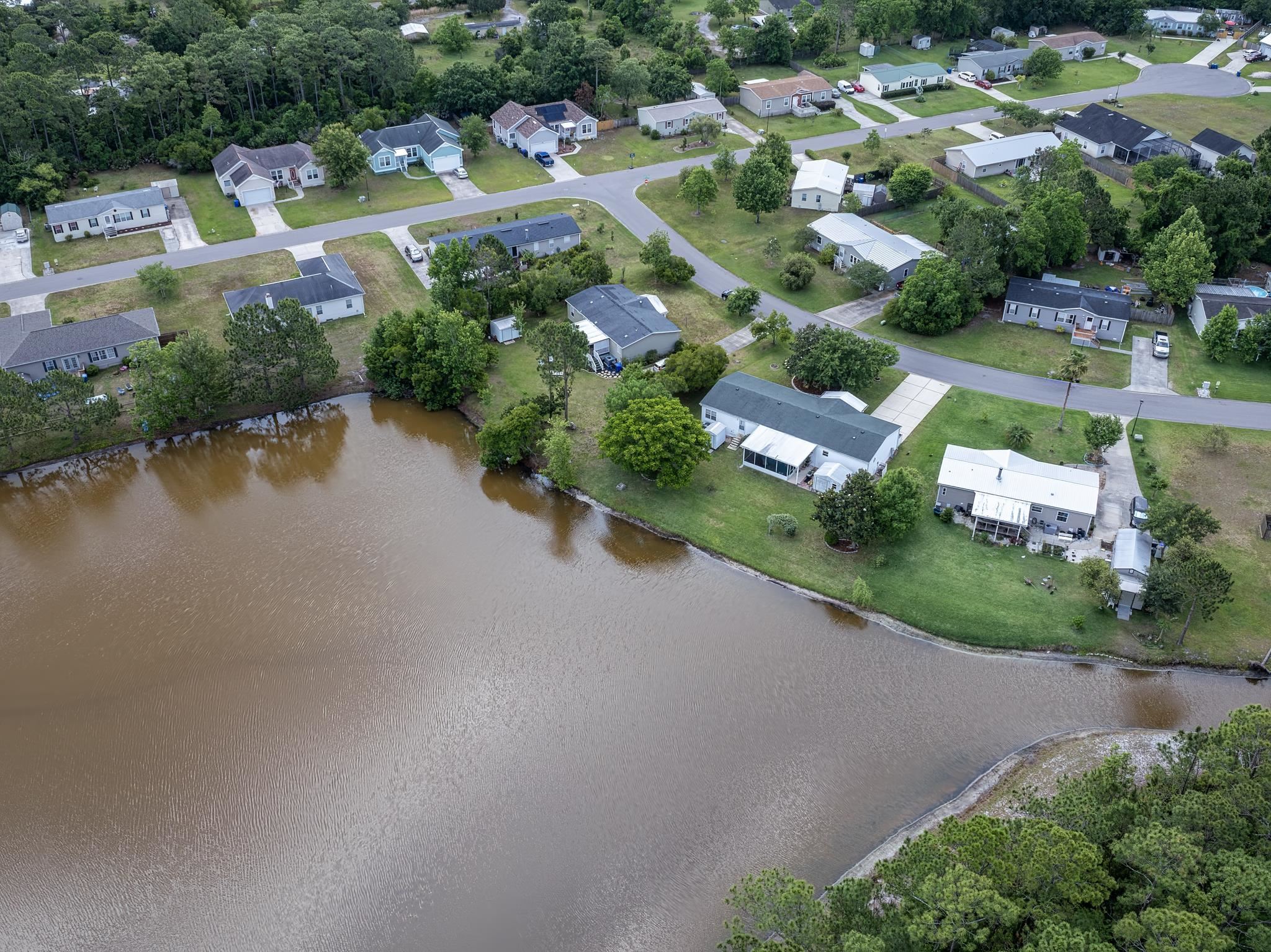 2257 Whippoorwill Drive St. Augustine, FL 32084 - Photo 48 of 50 an aerial view of a house with a swimming pool yard and lake view