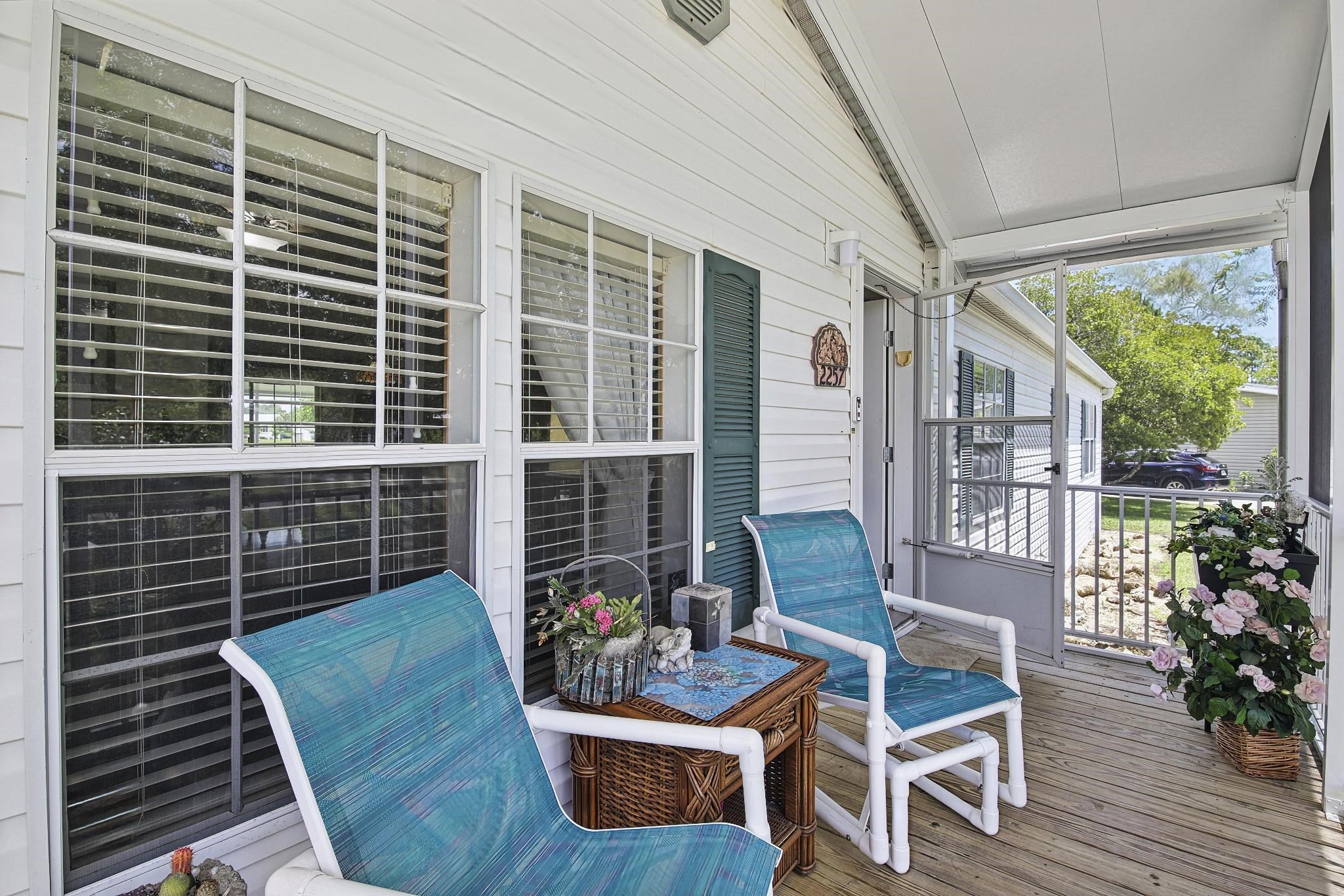2257 Whippoorwill Drive St. Augustine, FL 32084 - Photo 49 of 50 a house view with couches and potted plants