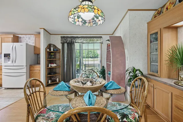 a view of a dining room with furniture window and outside view
