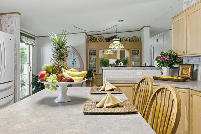 a living room filled with furniture and a chandelier