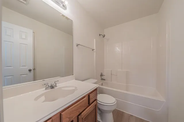 a bathroom with a sink a toilet and a bathtub
