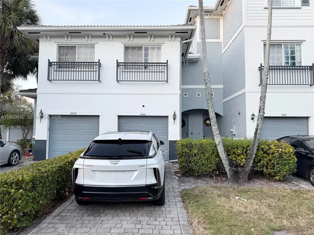 a car parked in front of a house