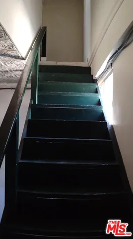 a bathroom with a sink toilet and a mirror