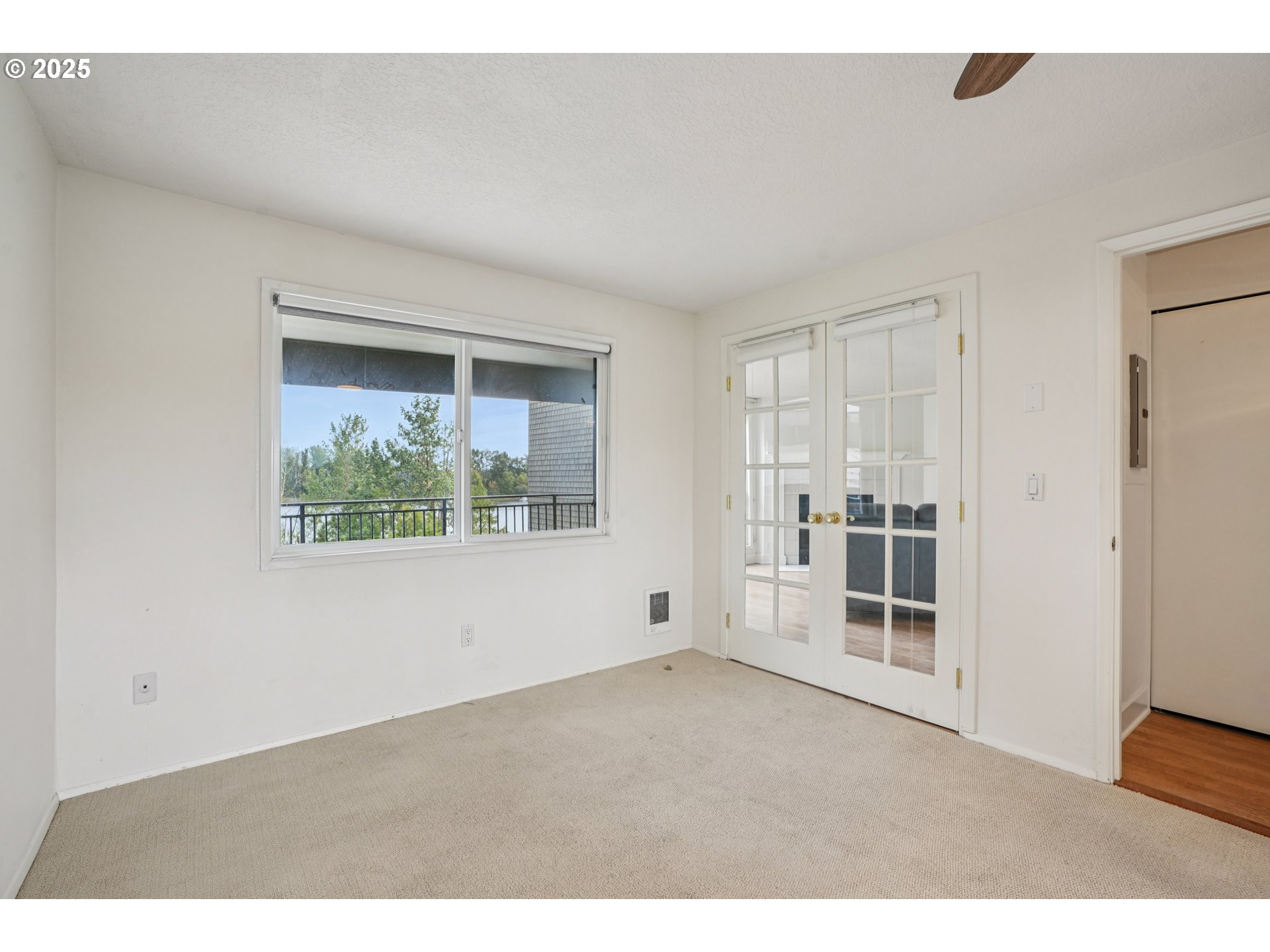 5620 South Riverside Lane, Unit 5 Portland, OR 97239 - Photo 19 of 39 a view of empty room with windows