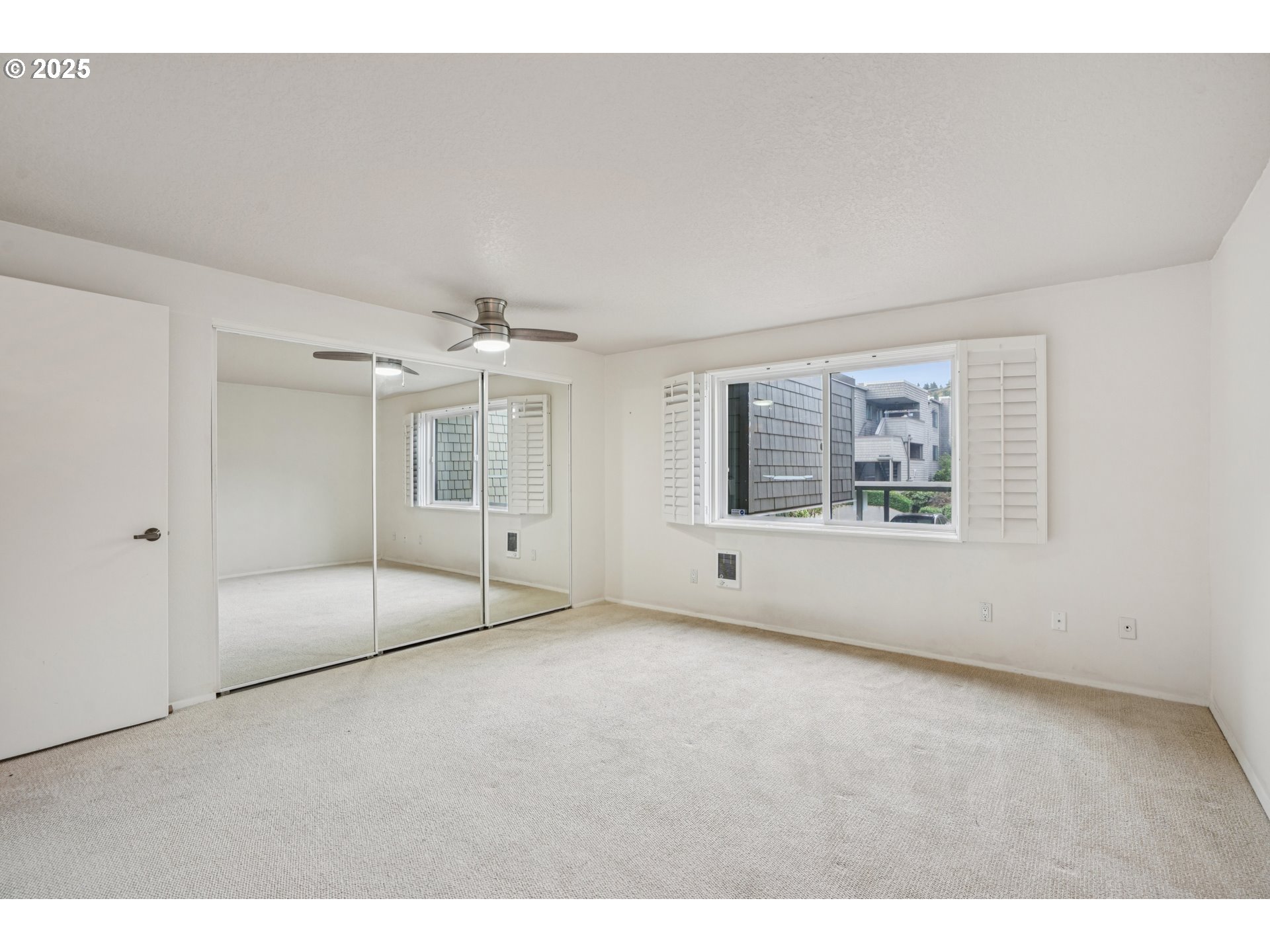 5620 South Riverside Lane, Unit 5 Portland, OR 97239 - Photo 26 of 39 a view of an empty room with a window