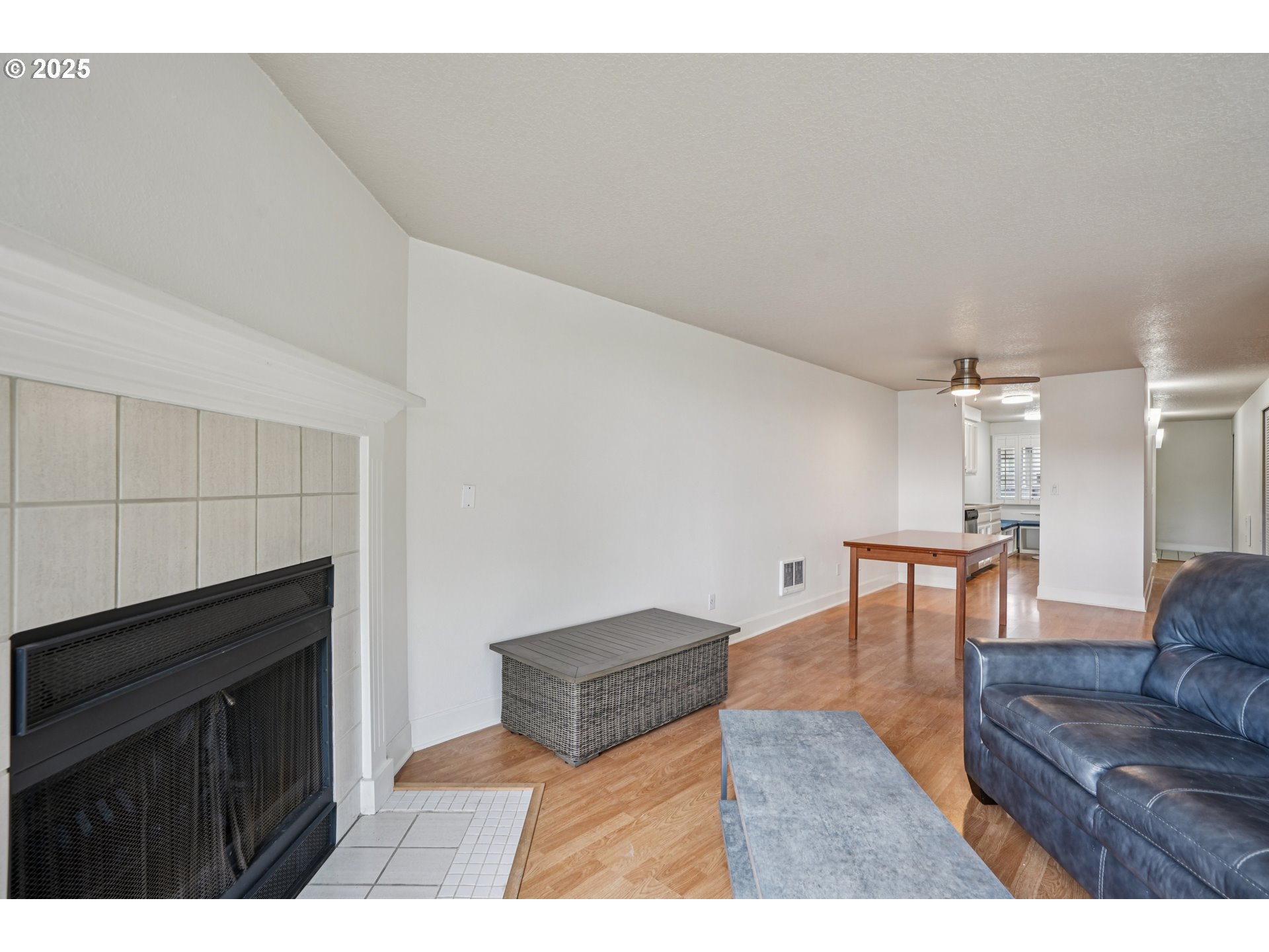 5620 South Riverside Lane, Unit 5 Portland, OR 97239 - Photo 8 of 39 a living room with furniture and a wooden floor