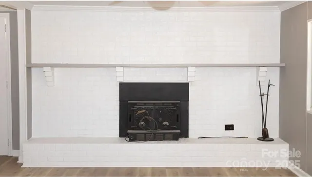 a black and white wall with a fireplace