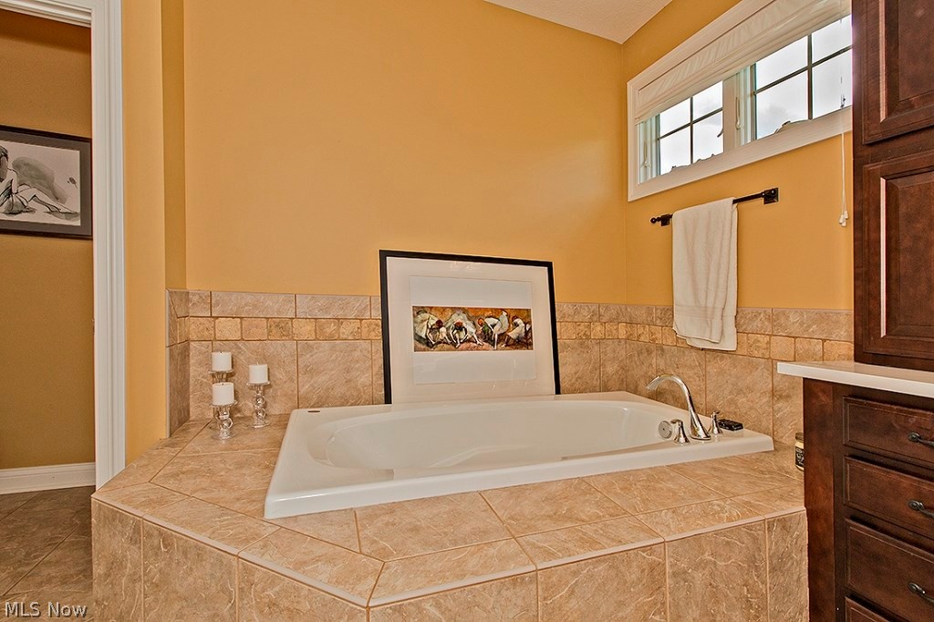 3375 Legends Way Cleveland, OH 44124 - Photo 21 of 33 Glamour Bathroom with Double Vanity with Custom Cabinetry and Granite Counter Top, Ceramic Tile Flooring, Jacuzzi Tub and Oversized Shower