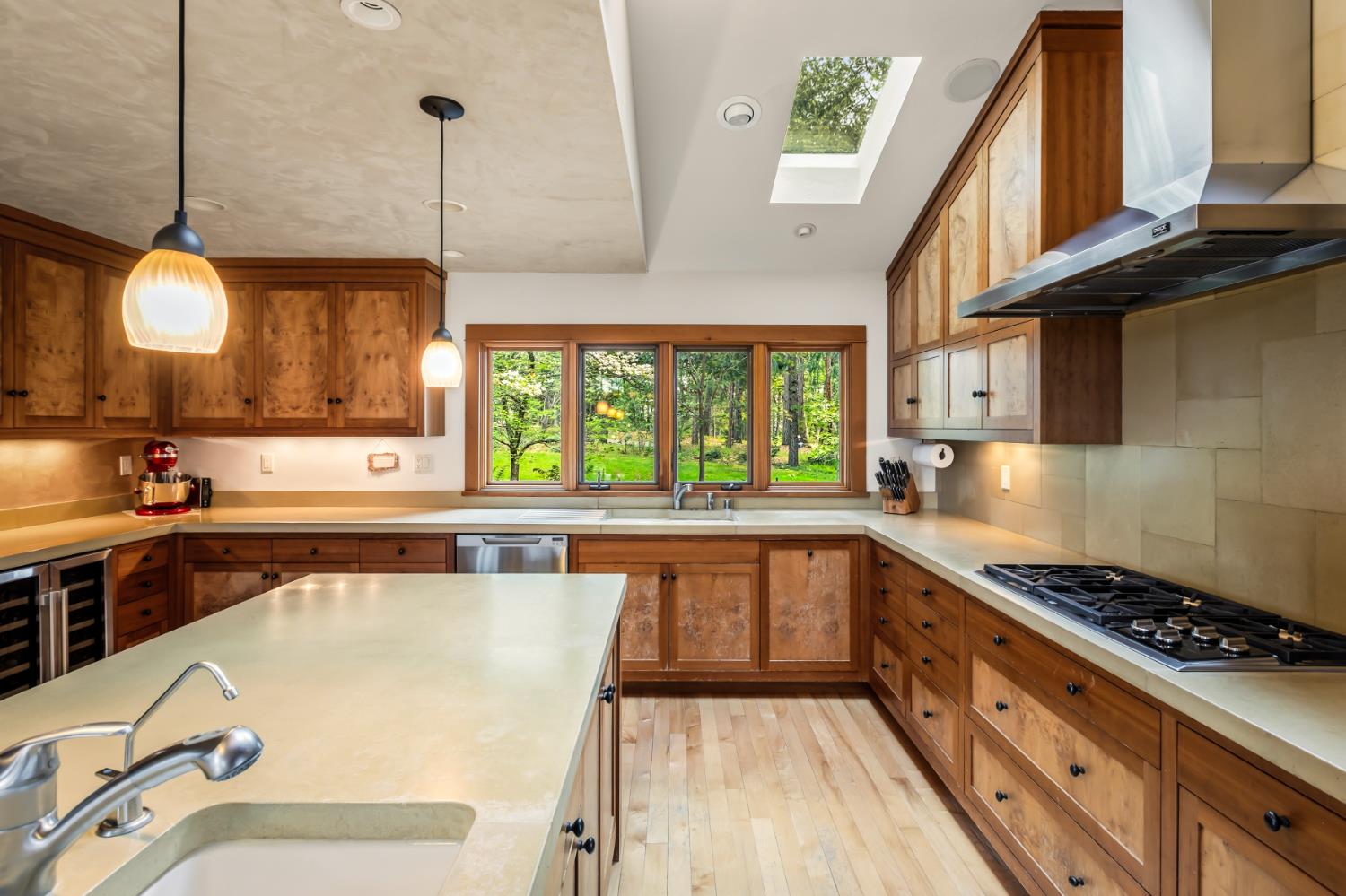 12278 Cement Hill Road Nevada City, CA 95959 - Photo 16 of 61 a kitchen with stainless steel appliances granite countertop a stove a sink and a wooden floors