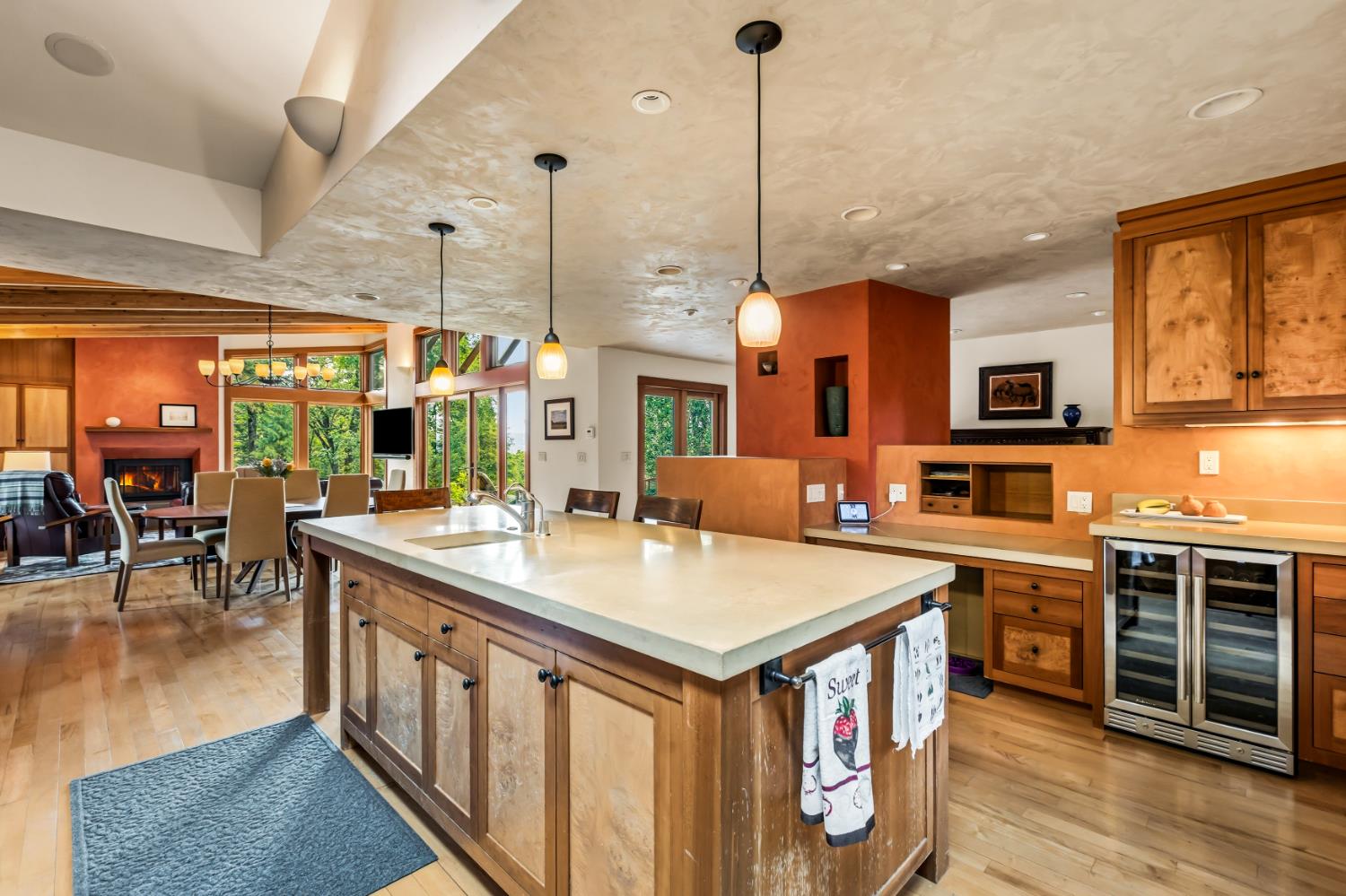 12278 Cement Hill Road Nevada City, CA 95959 - Photo 18 of 61 a large kitchen with stainless steel appliances a stove a sink dishwasher and a dining table with the view of living room