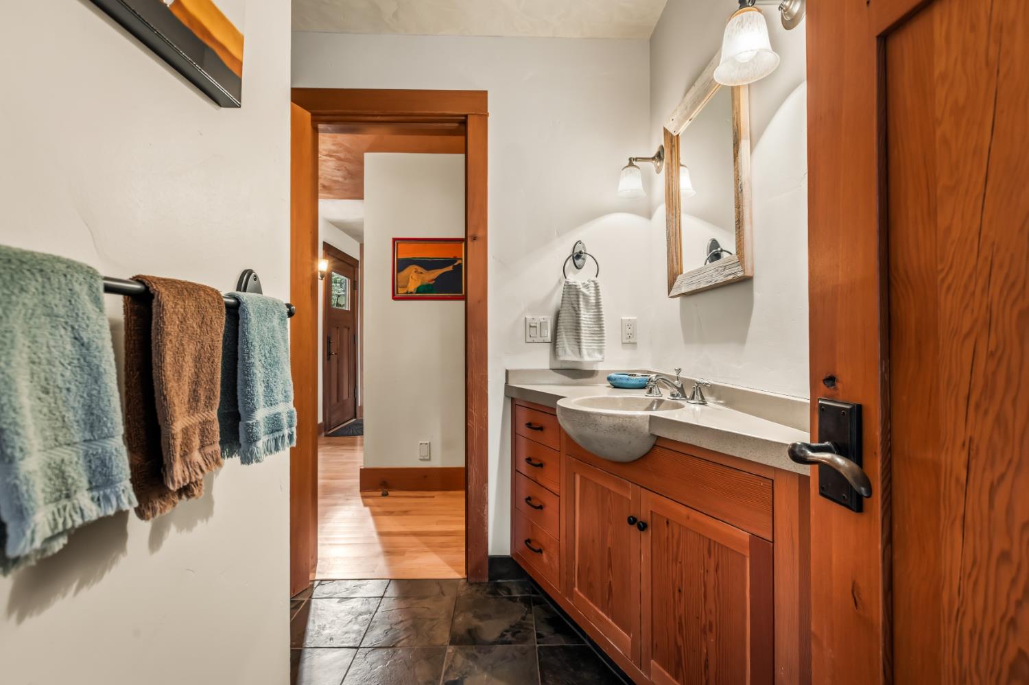 12278 Cement Hill Road Nevada City, CA 95959 - Photo 23 of 61 a bathroom with a sink a mirror and shower