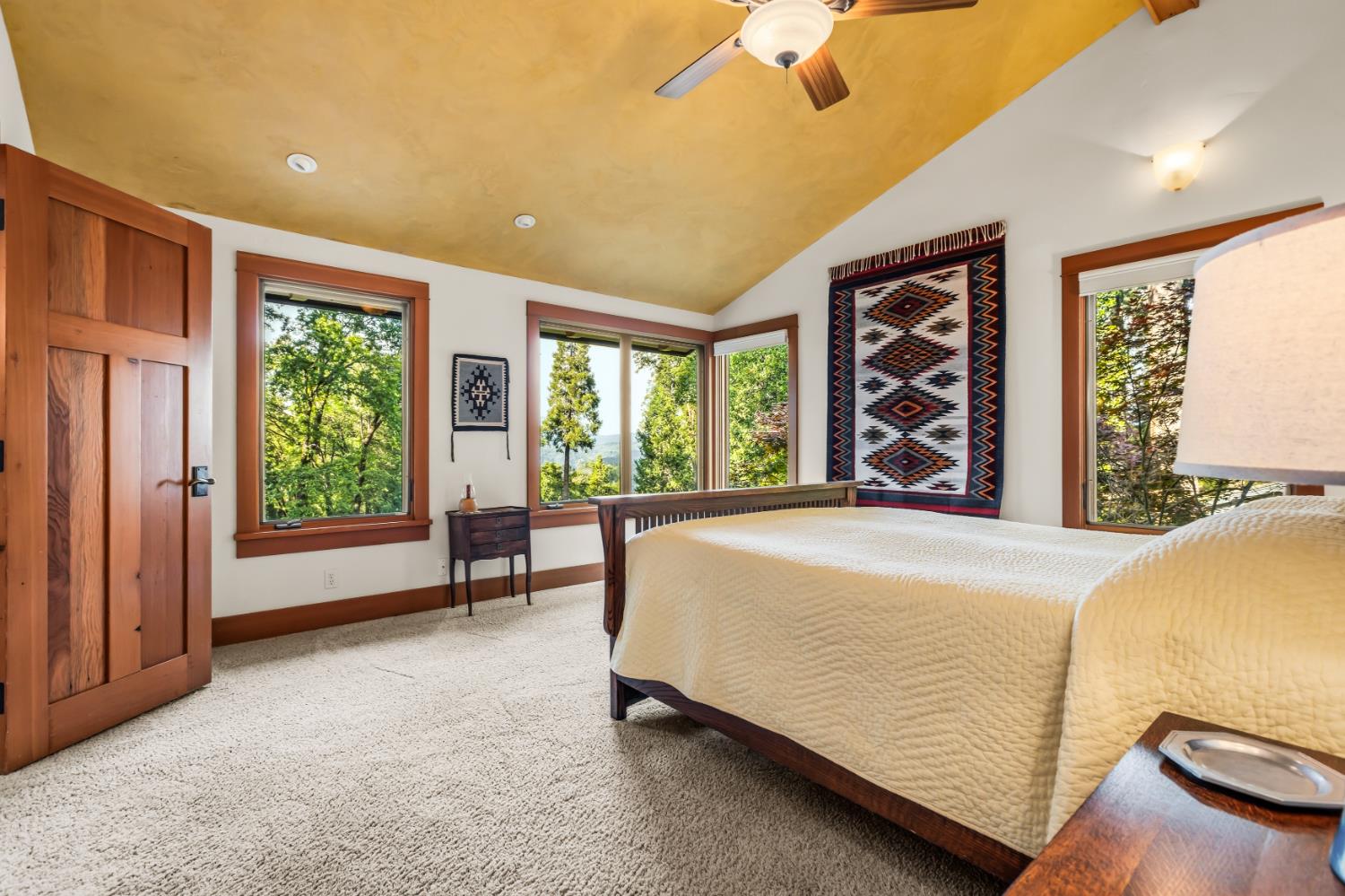 12278 Cement Hill Road Nevada City, CA 95959 - Photo 27 of 61 a bed sitting in a spacious bedroom next to a window
