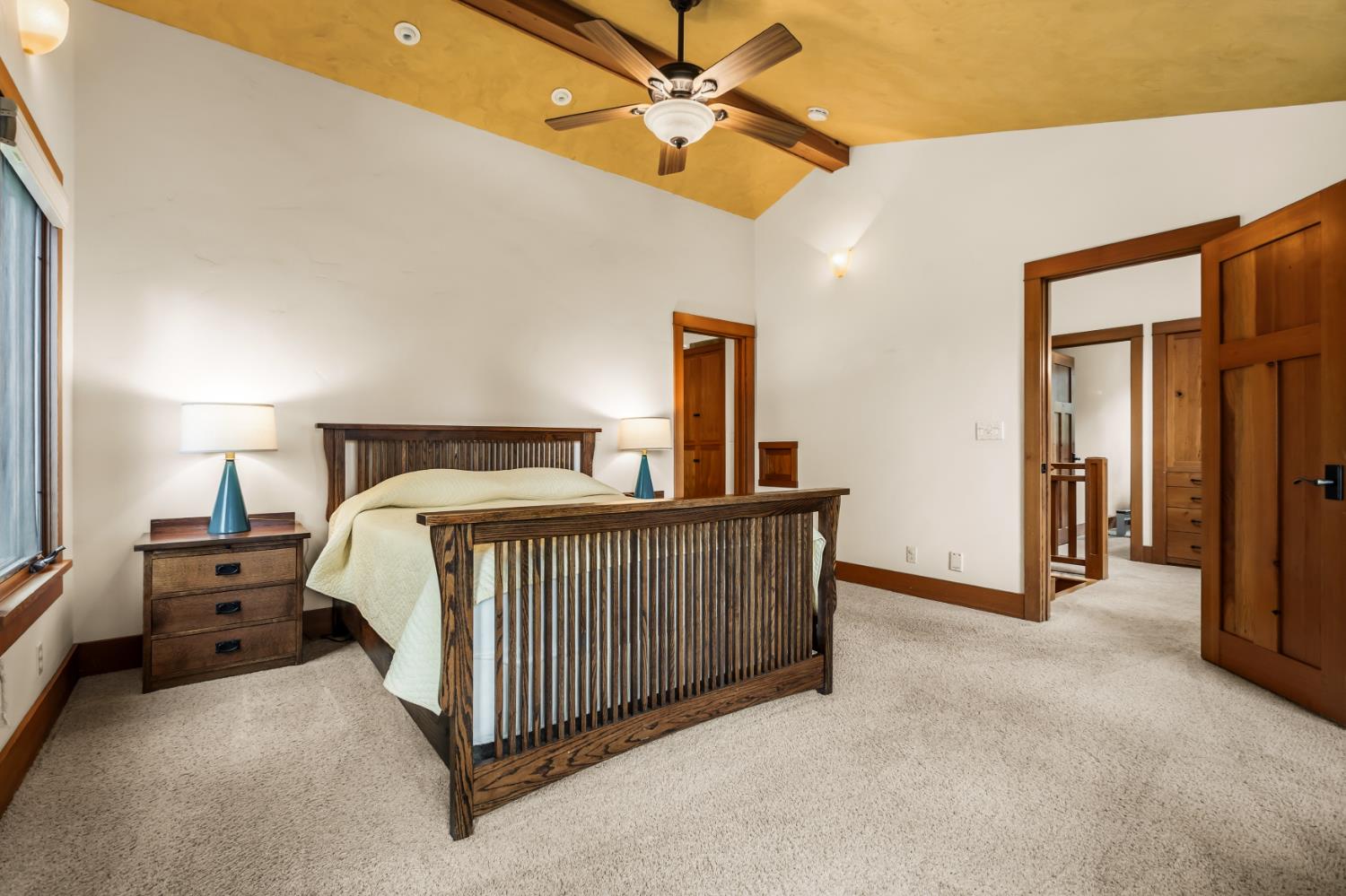 12278 Cement Hill Road Nevada City, CA 95959 - Photo 28 of 61 a bedroom with a bed and a ceiling fan