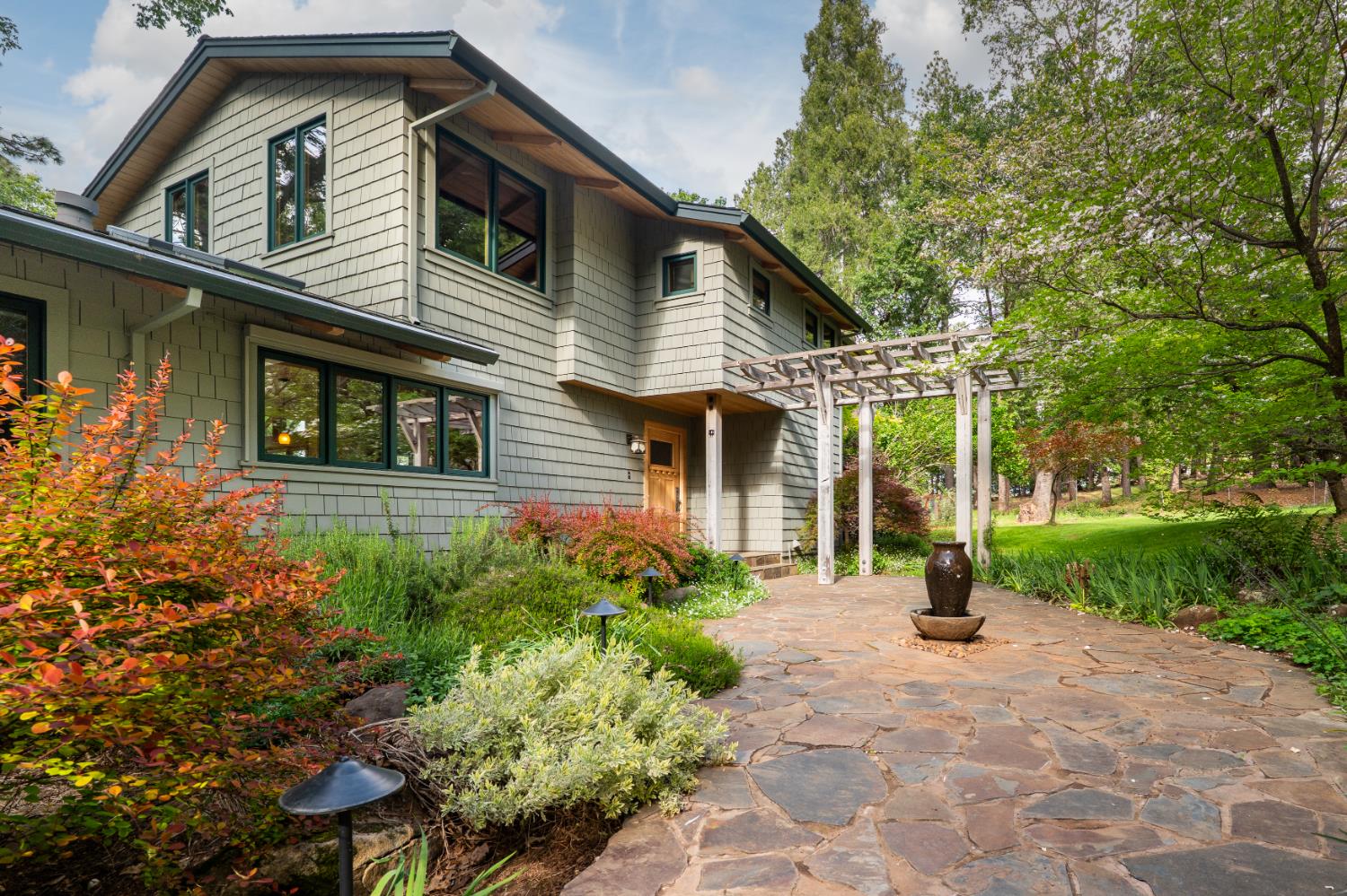 12278 Cement Hill Road Nevada City, CA 95959 - Photo 4 of 61 a front view of a house with garden