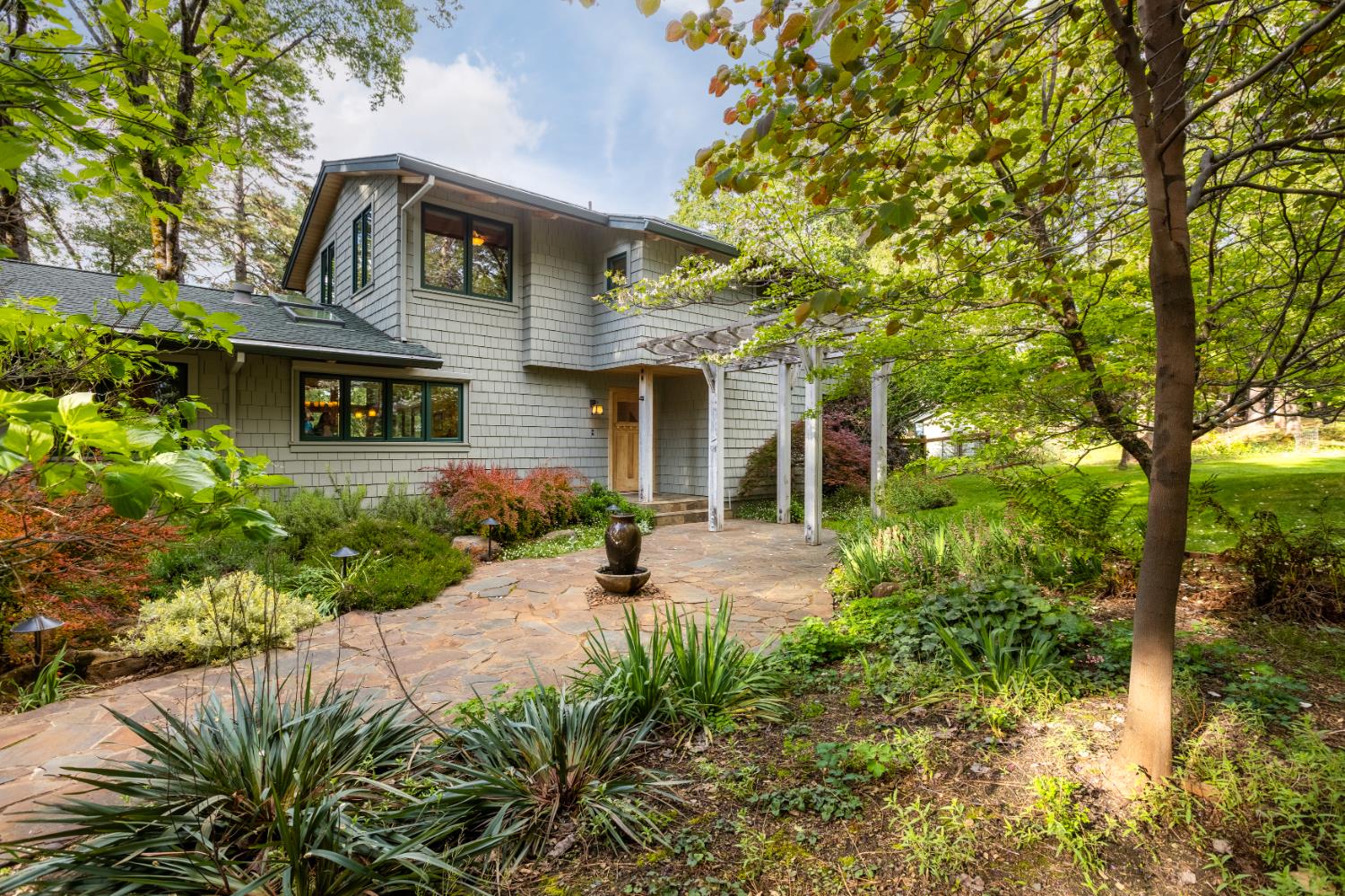 12278 Cement Hill Road Nevada City, CA 95959 - Photo 5 of 61 a front view of a house with a yard and porch