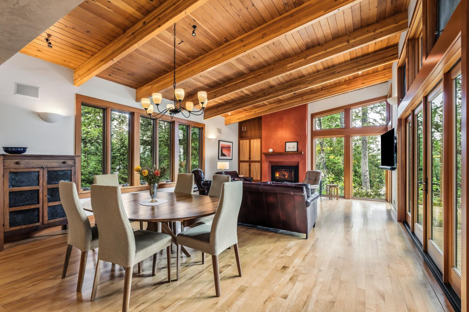 12278 Cement Hill Road Nevada City, CA 95959 - Photo 7 of 61 a view of a dining room with furniture large windows and wooden floor