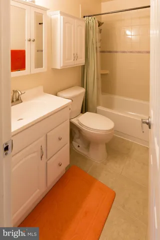 a bathroom with a toilet a sink a bath tub and shower